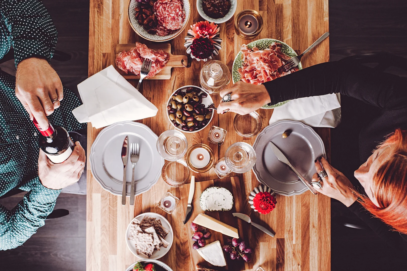Food, wine and people at a table