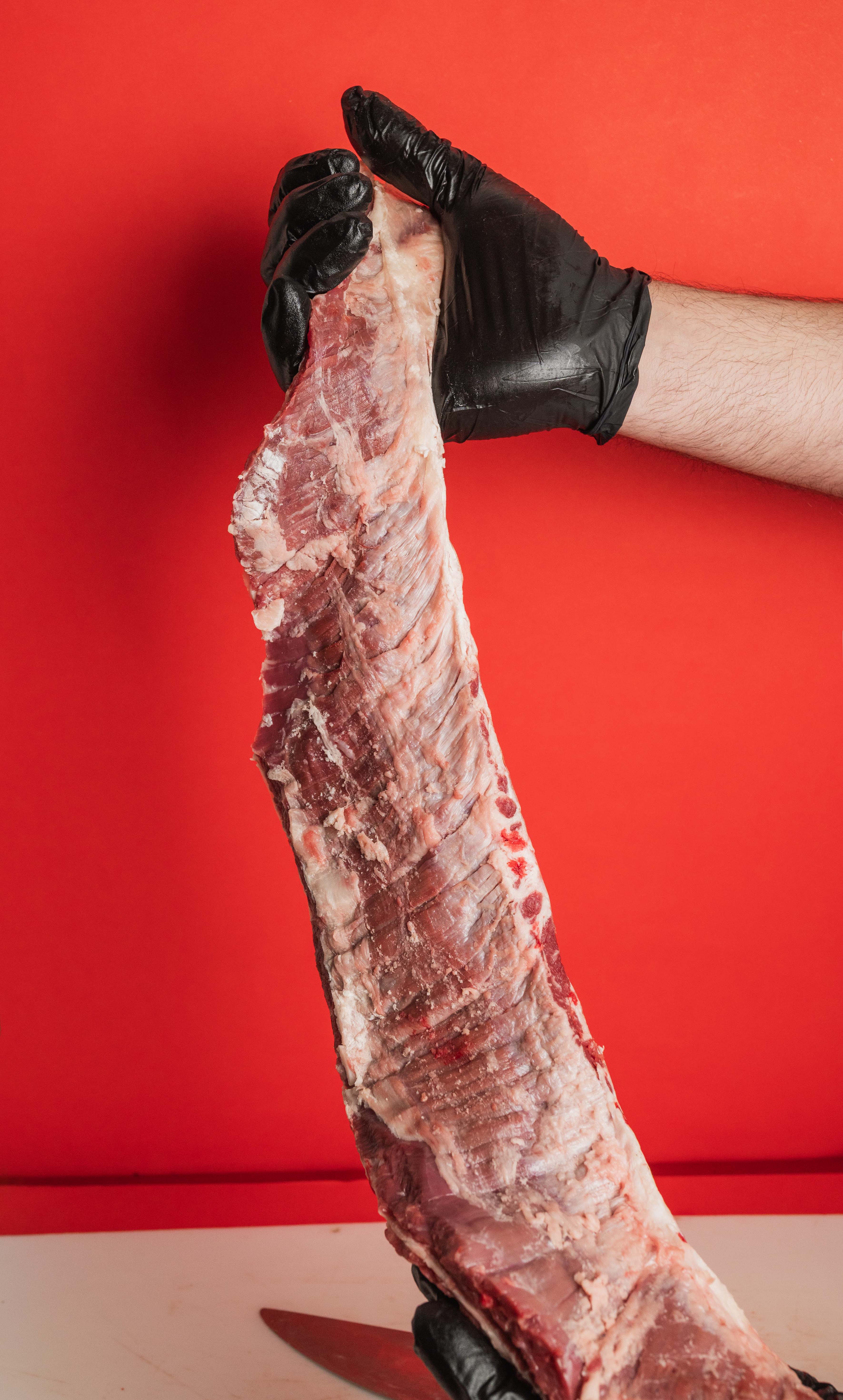 a person cutting up some food on a cutting board
