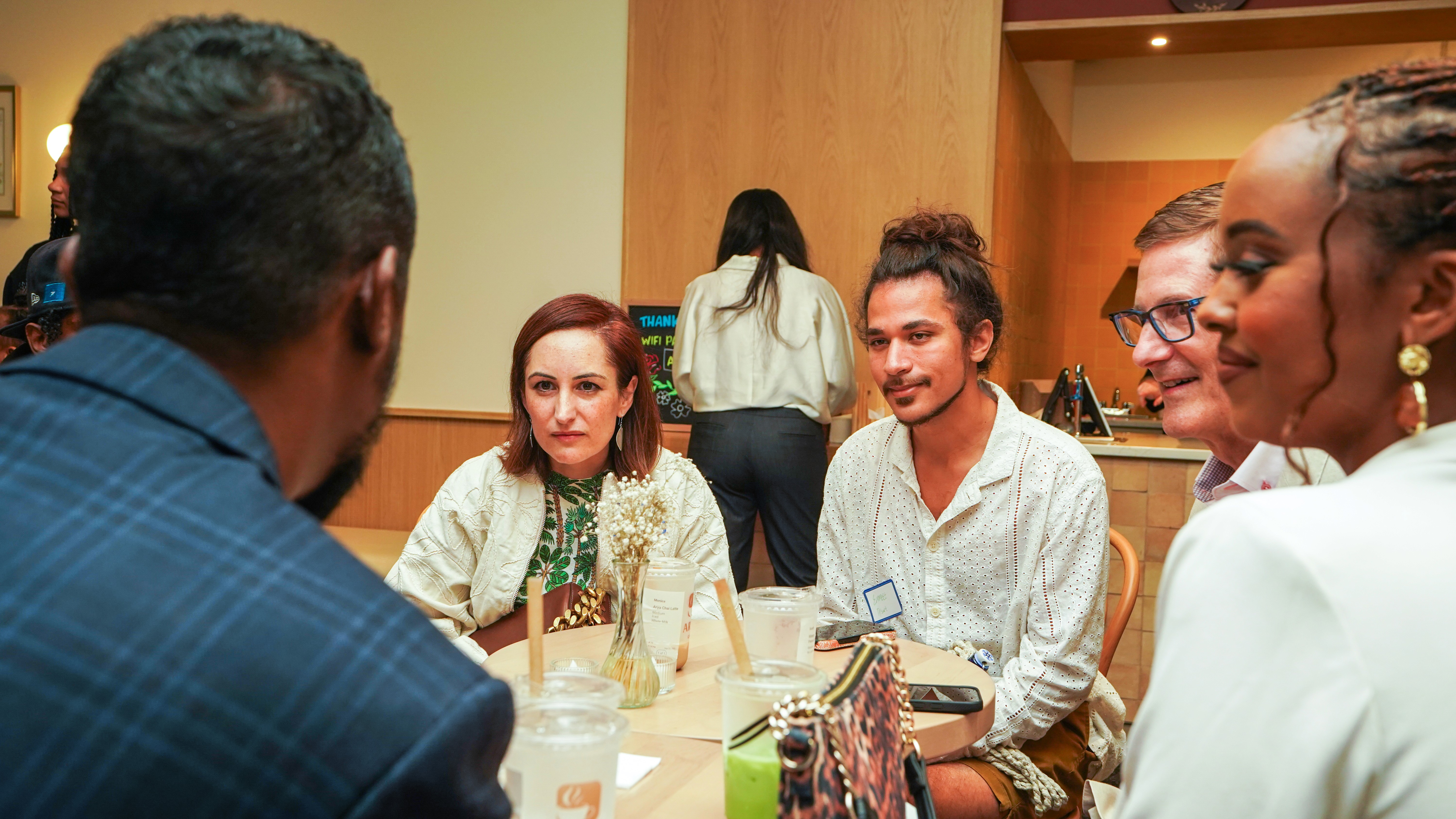 selective focus photography of girl drinking water
