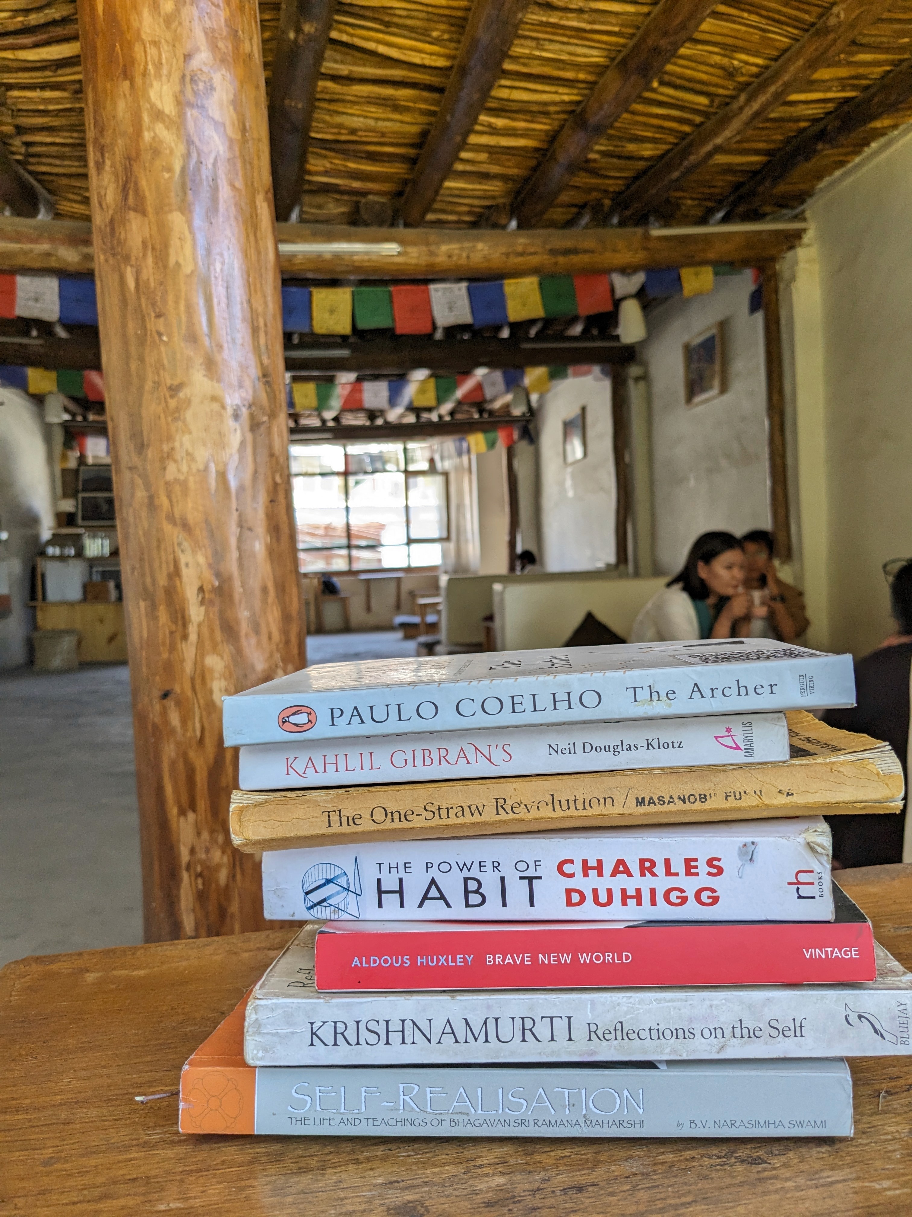 image of stack of books in a Tibetan cafe