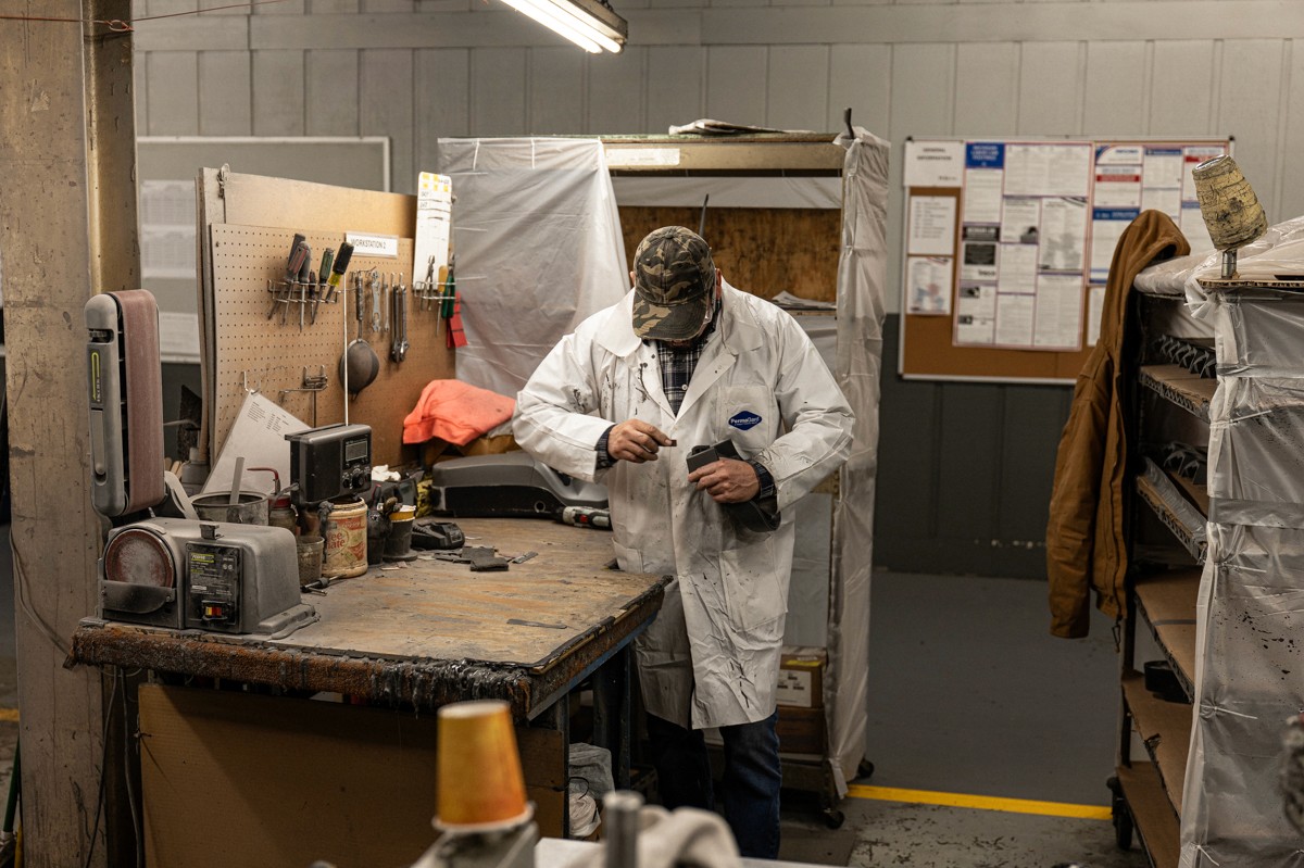 PURforms employee trimming polyurethane part