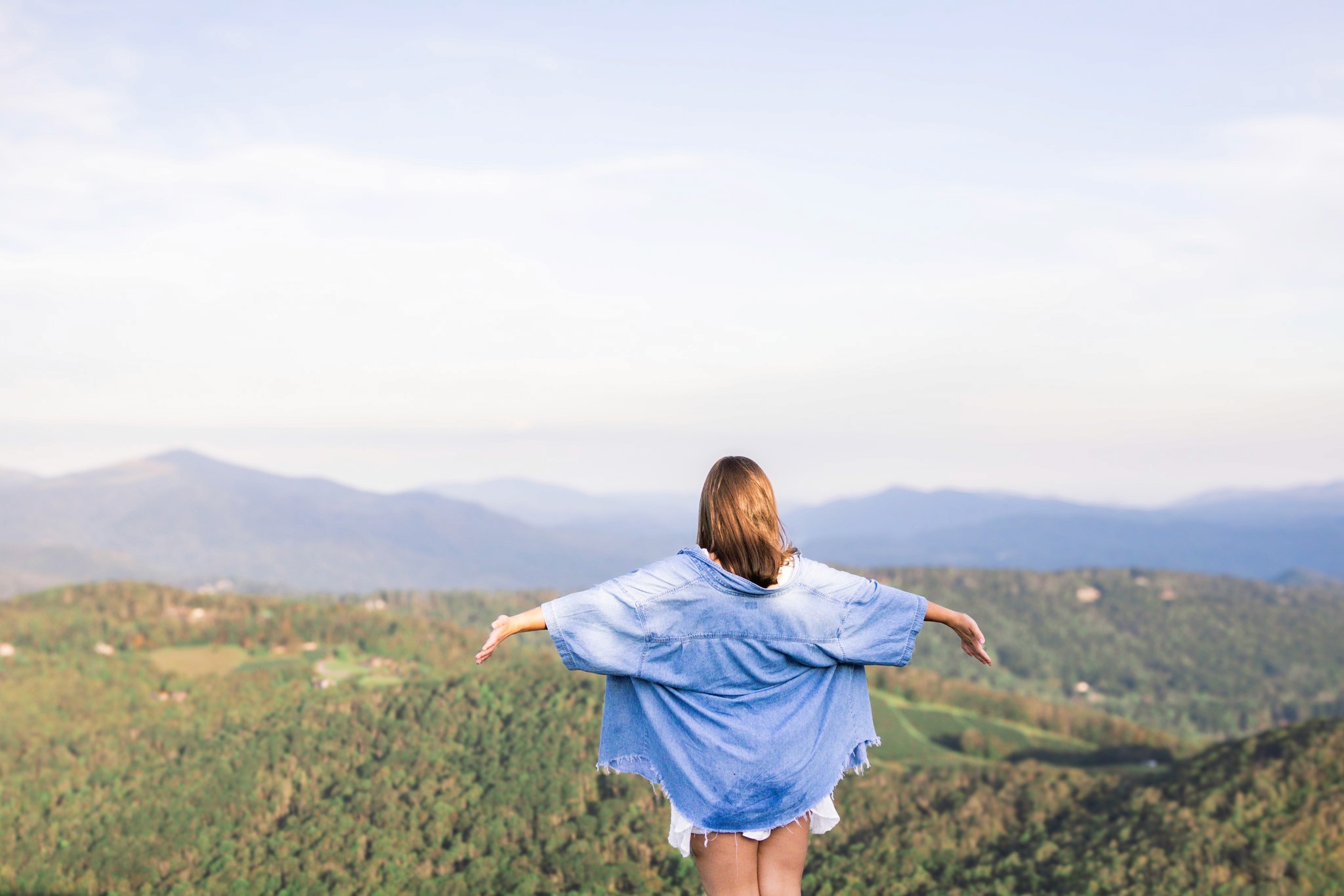 a woman holding an apple