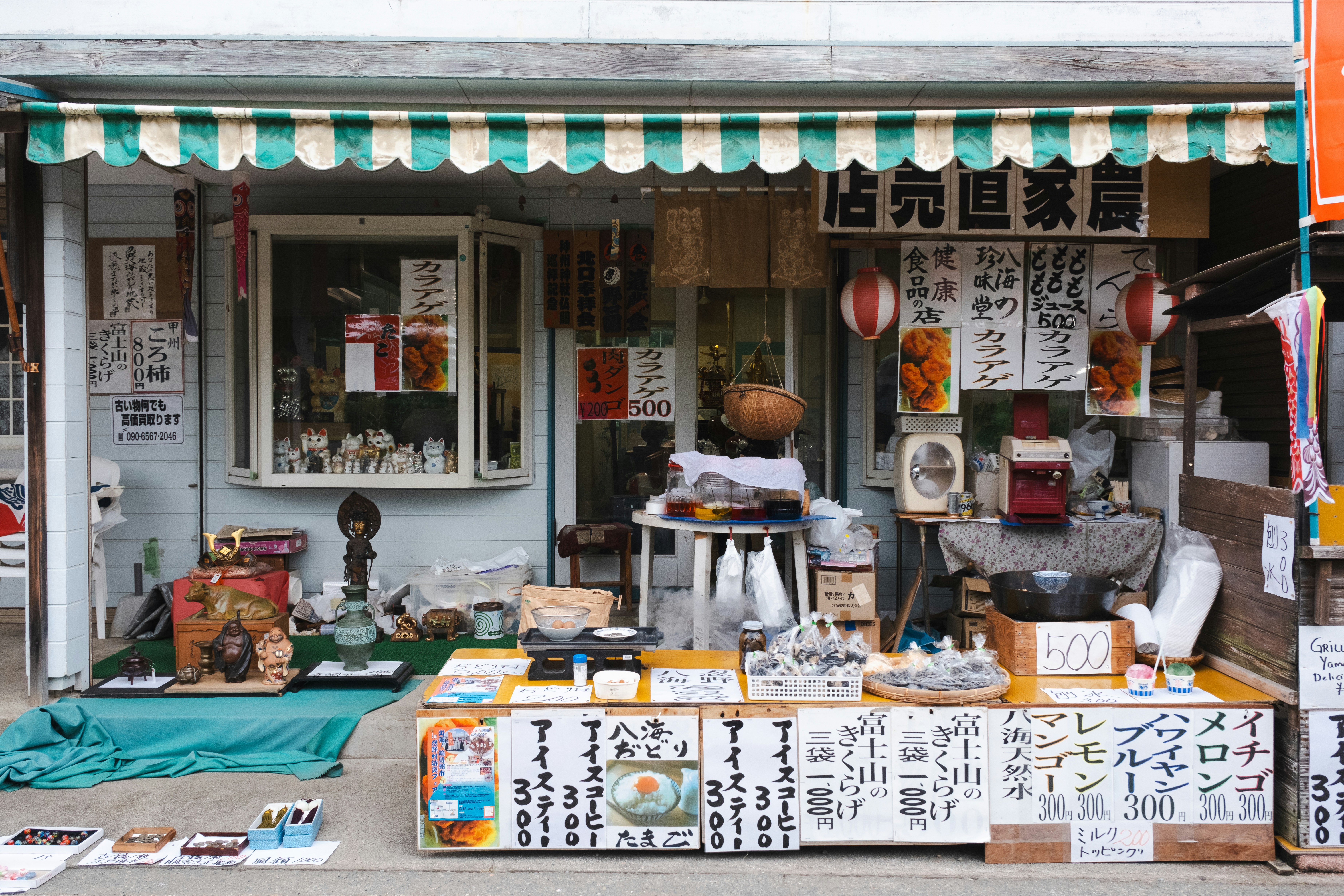 A small store with a lot of stuff on display