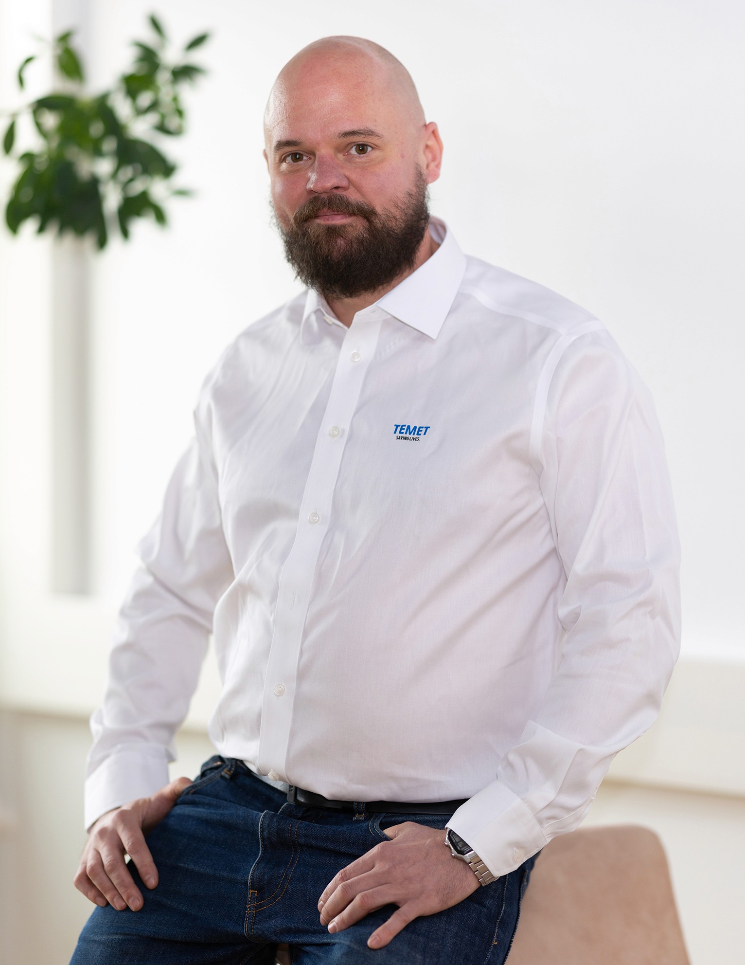 Portrait of John Doe Anderson, CEO of Omnis.