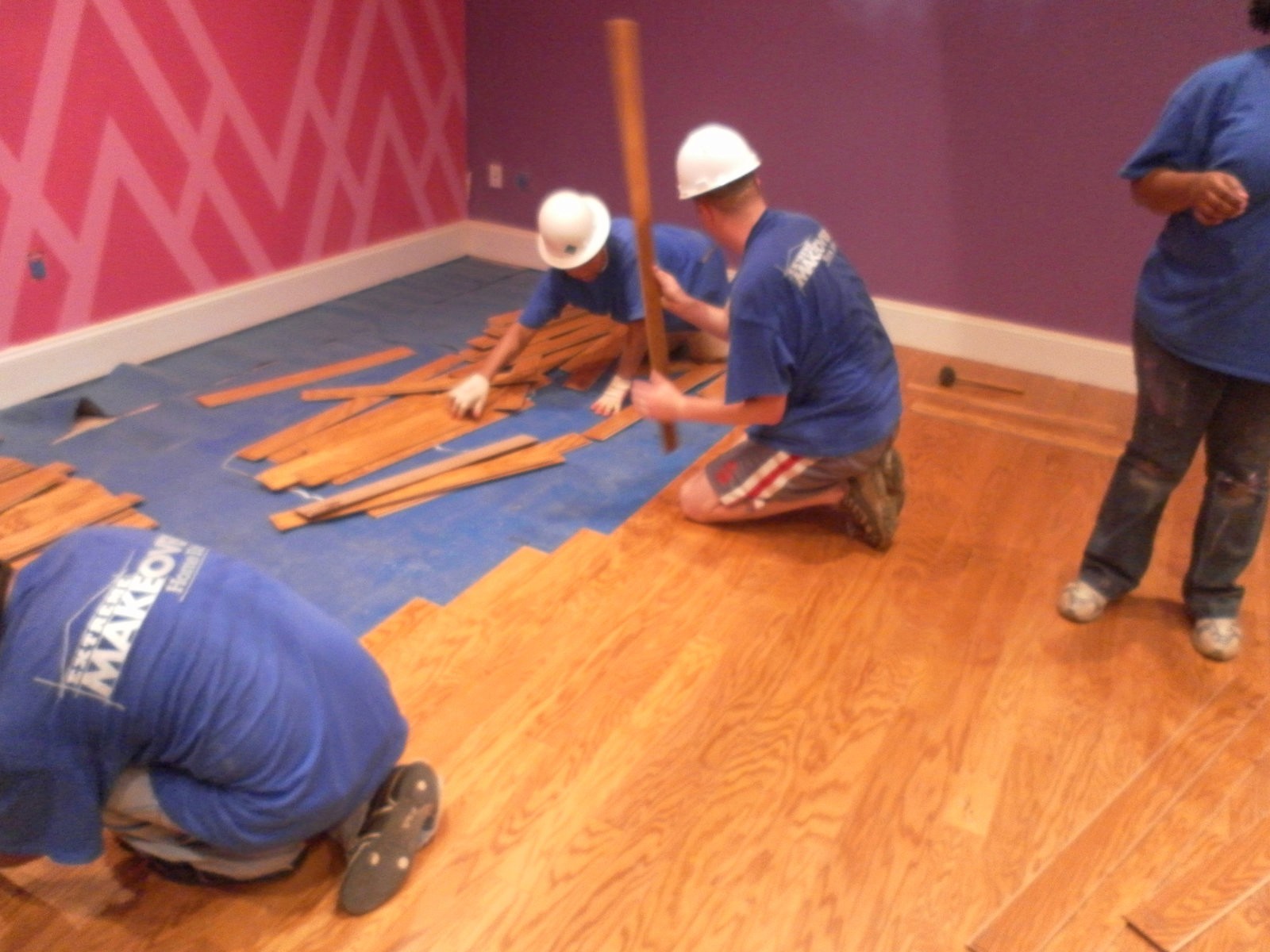 Me installing floors for the Extreme Home Makeover show