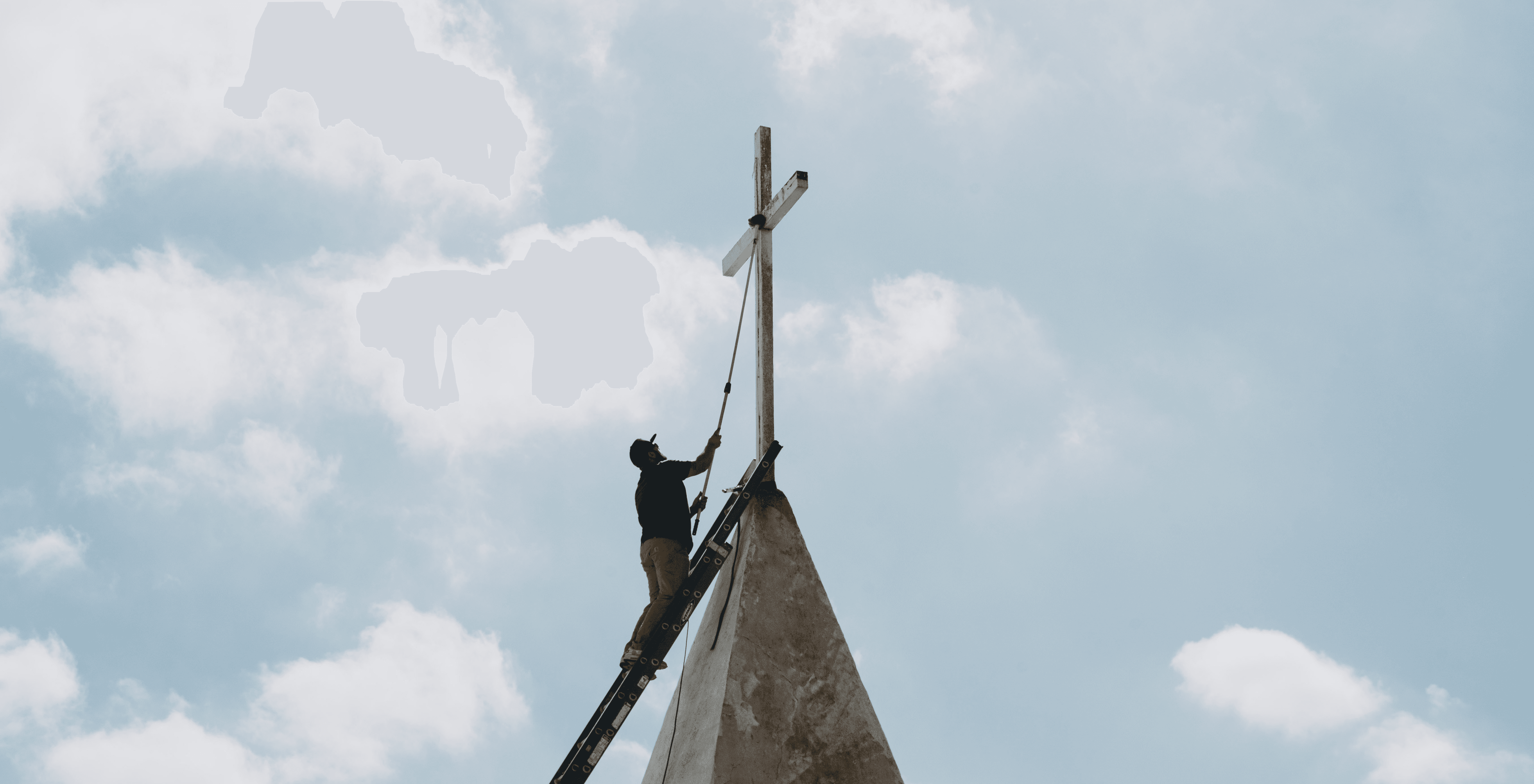 person sitting on grass and using phone