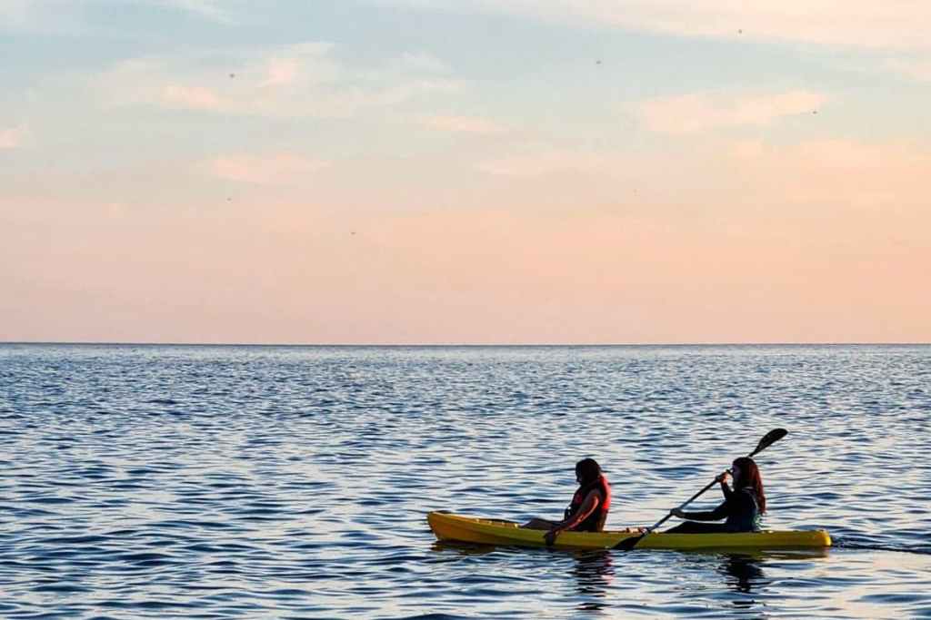 Kayakers on the sea at sunset, Cinque Terre