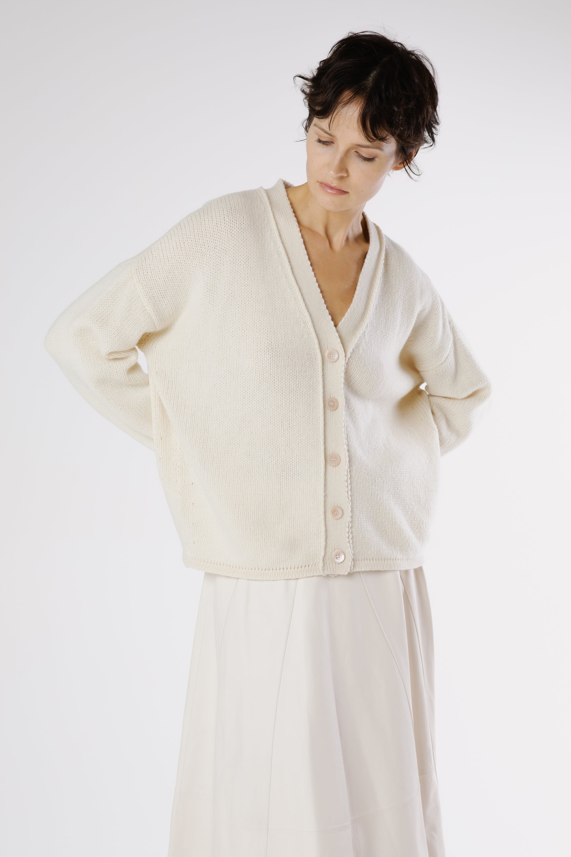 Model wearing Erro Cashmere Cardigan Sphinx styled with tailored trousers for elegant neutral look.