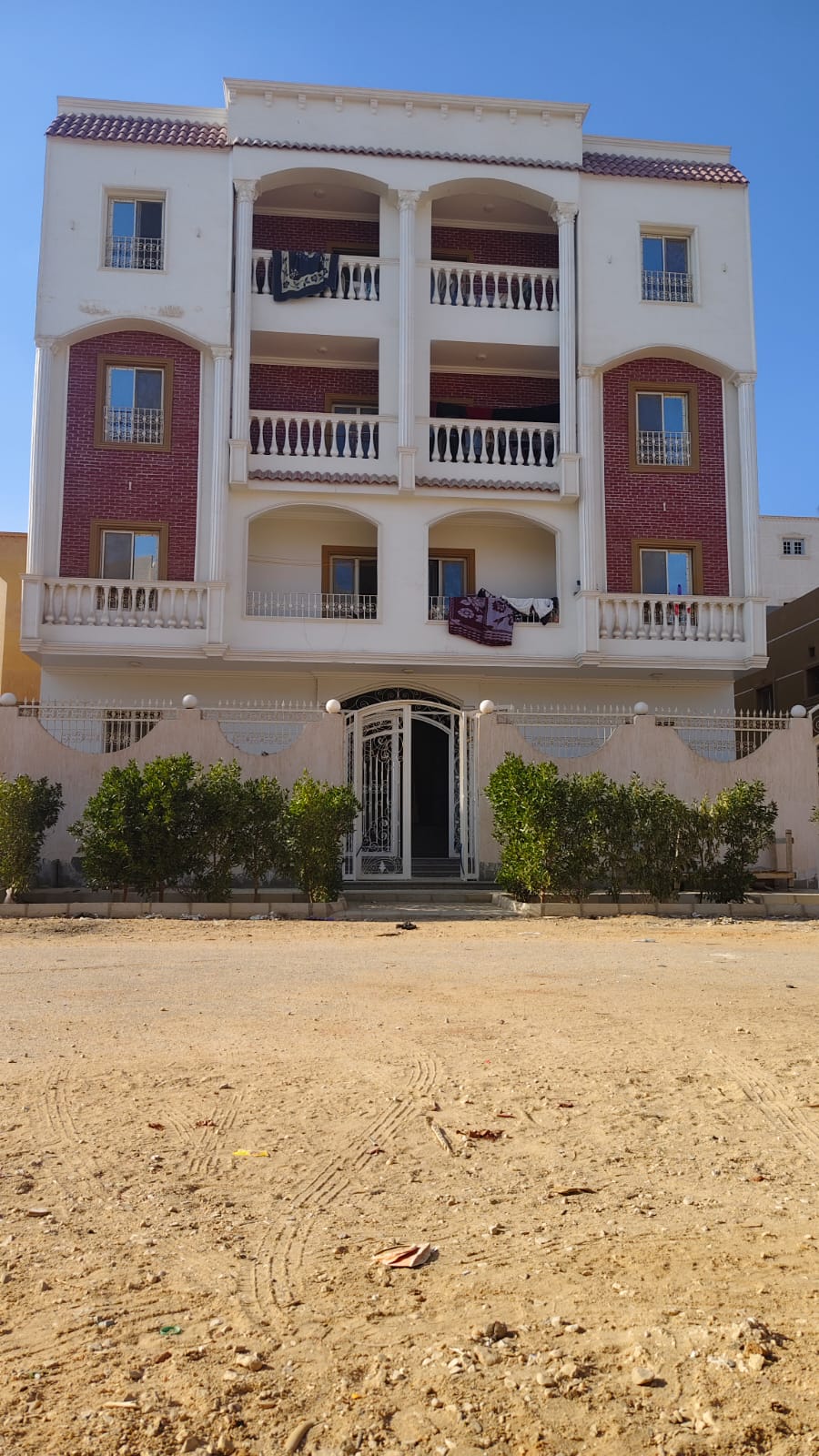woman in blue hijab sitting on chair