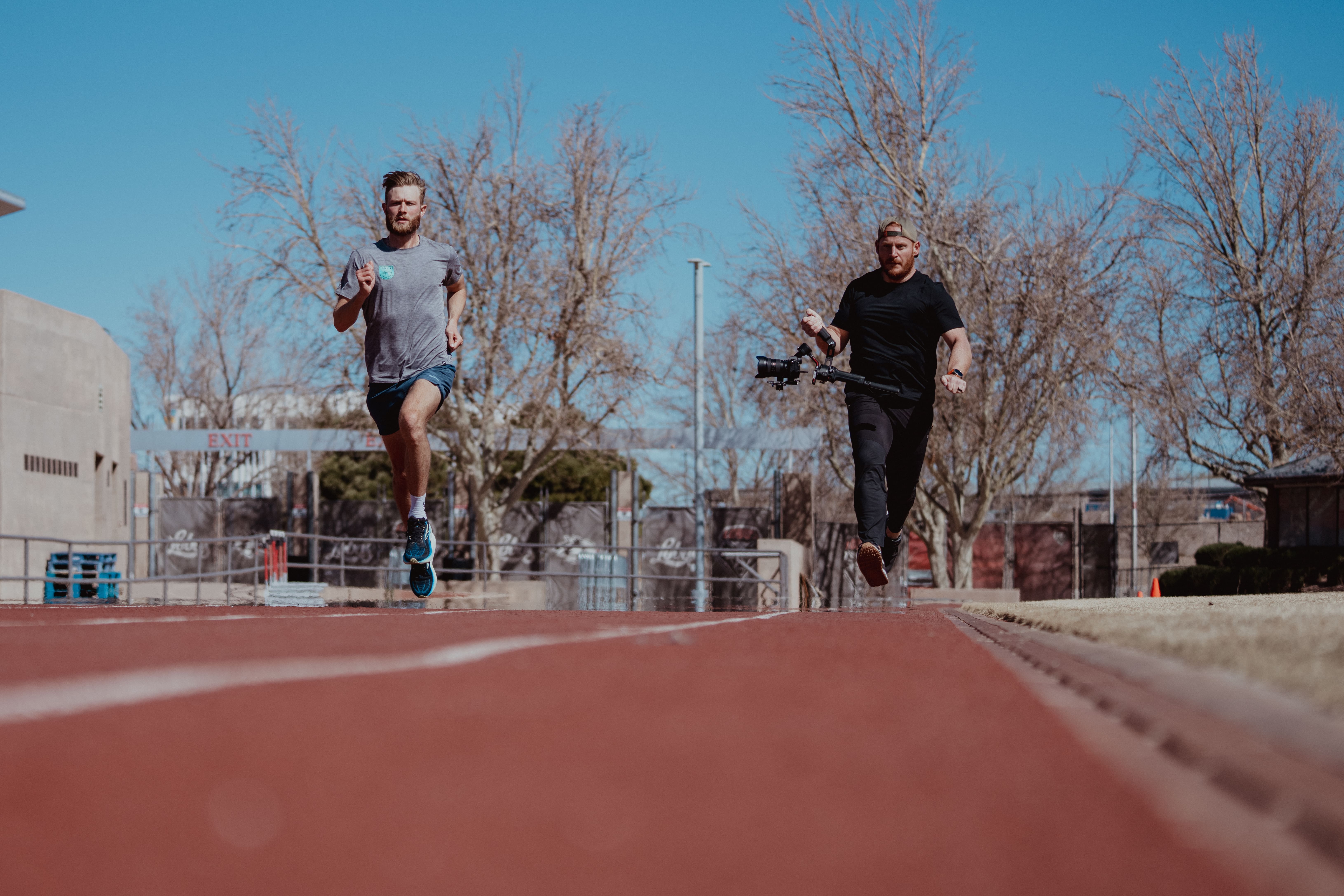 person running with a friend - How to Get Faster at Sprinting