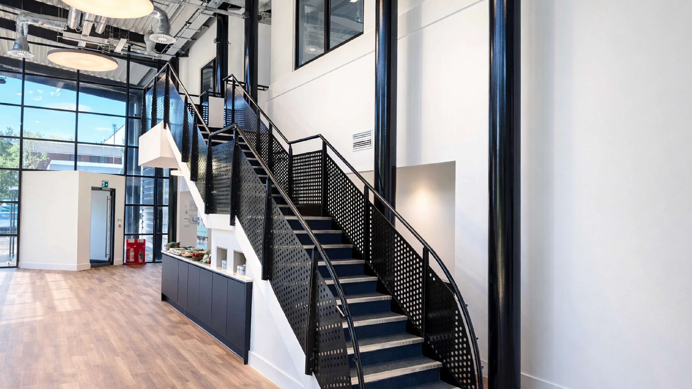 Tuscany Way interior shot of black staircase and reception area