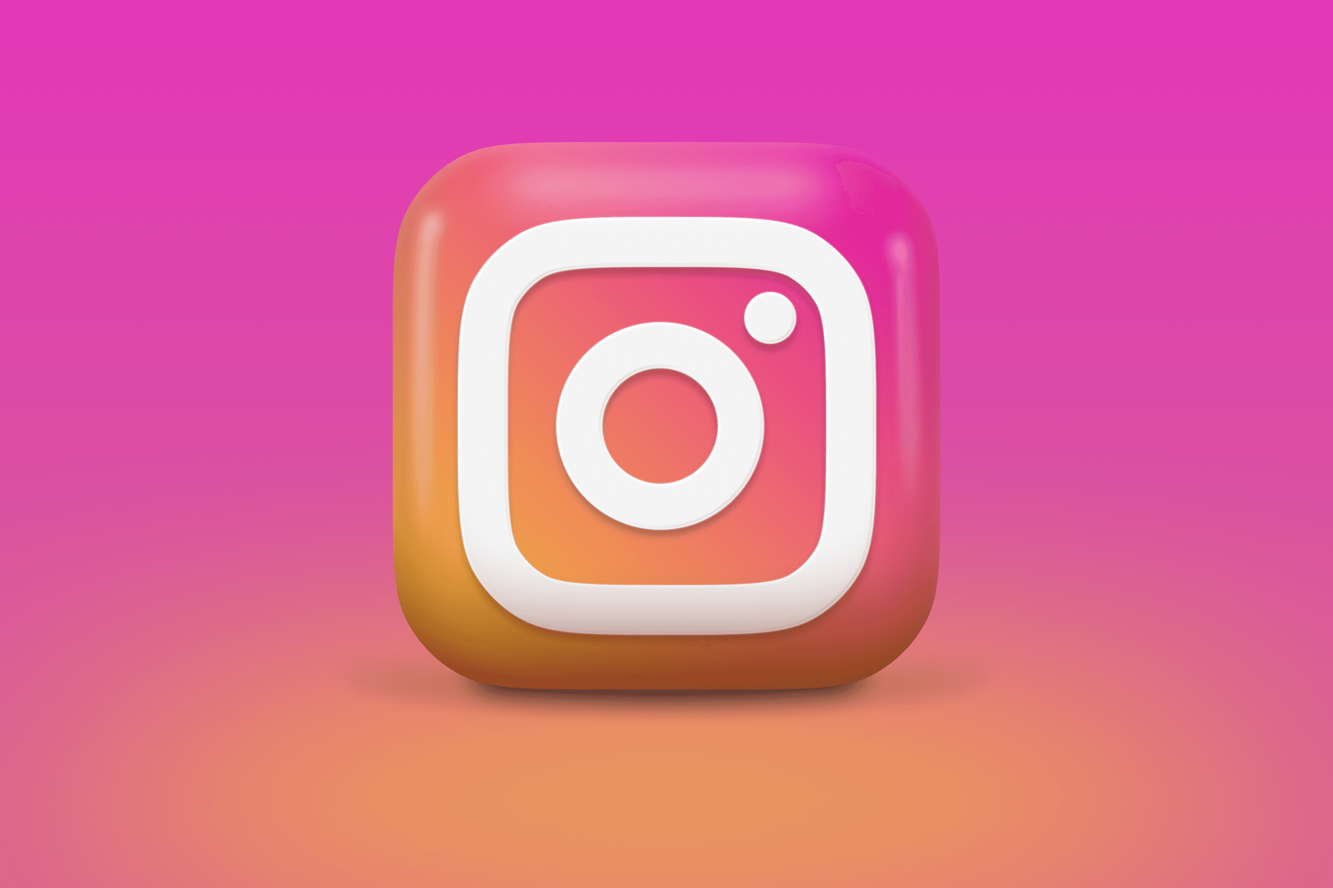 A 3D logo of Instagram with a gradient orange and pink background