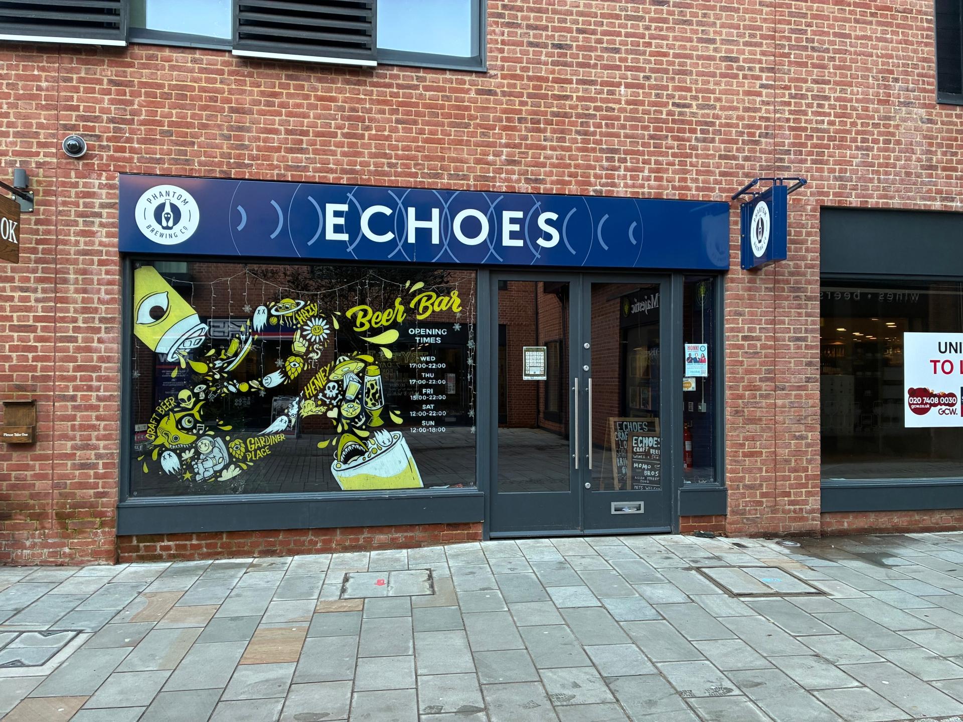 photo of a shop window with the shop name 'echoes' and an illustration on the window
