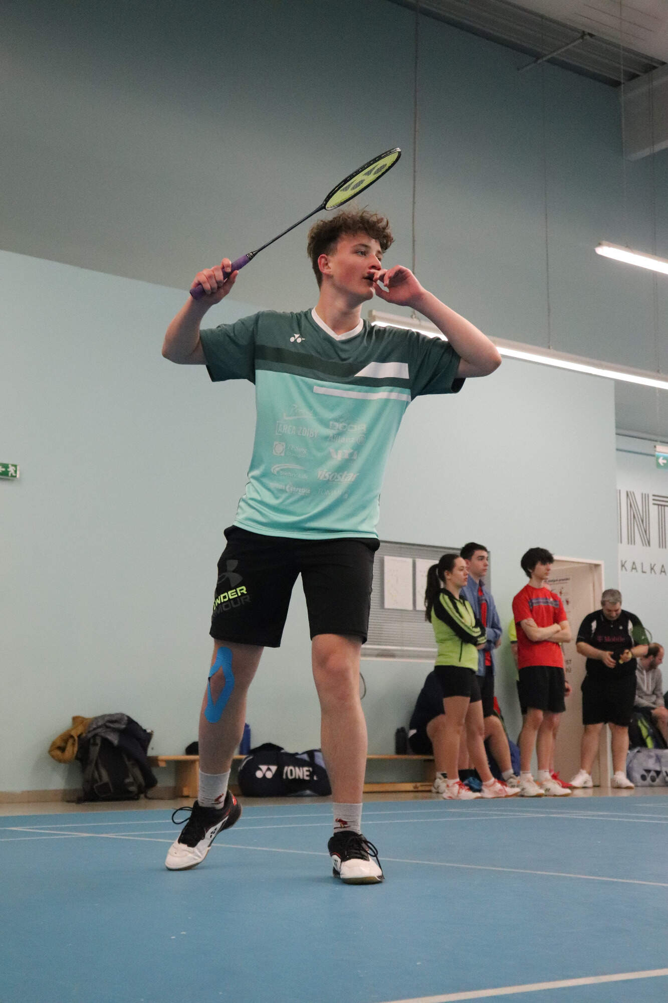 a japanese style building with a japanese roof and trees around it