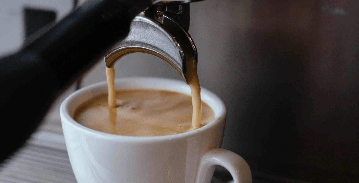 Close-up of a traditional coffee machine preparing coffee