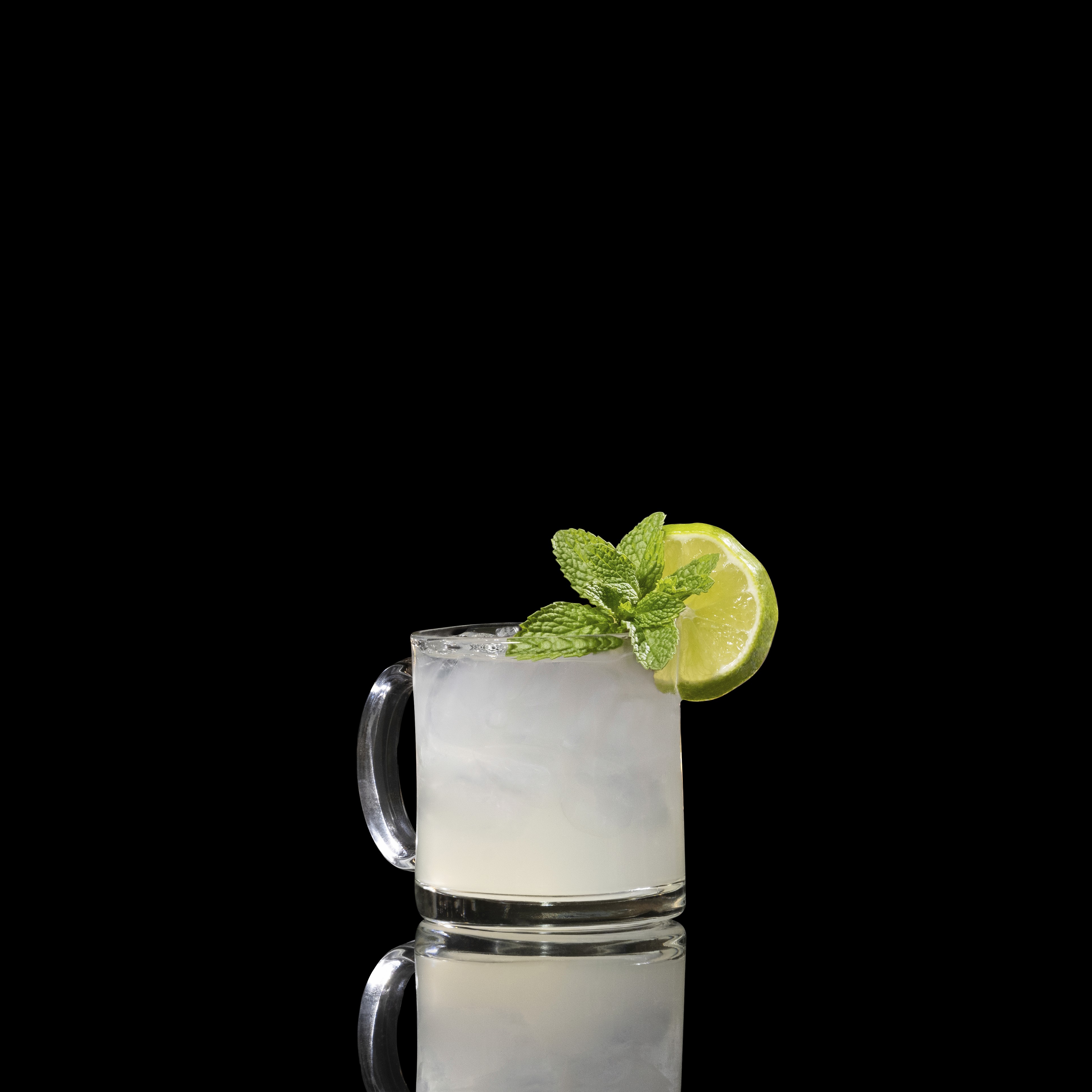 A closeup of a Austrian Mule drink against a dark background.
