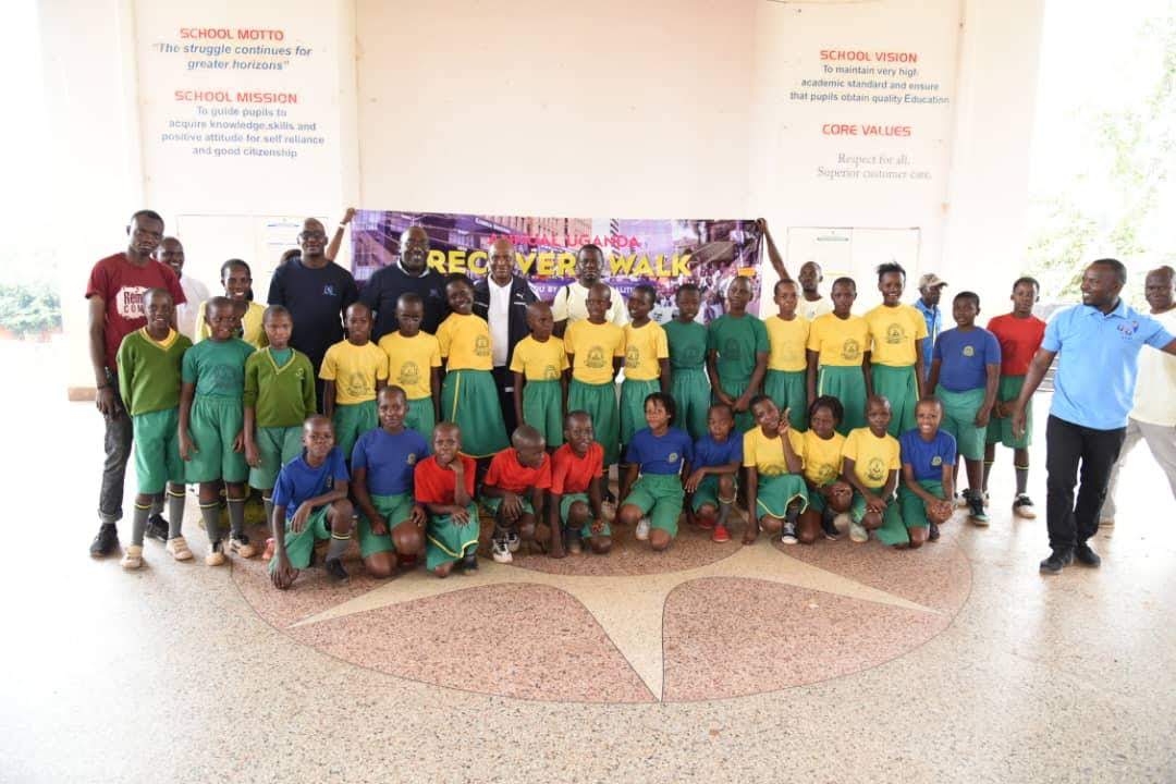 woman in black blazer covering her face with her hand