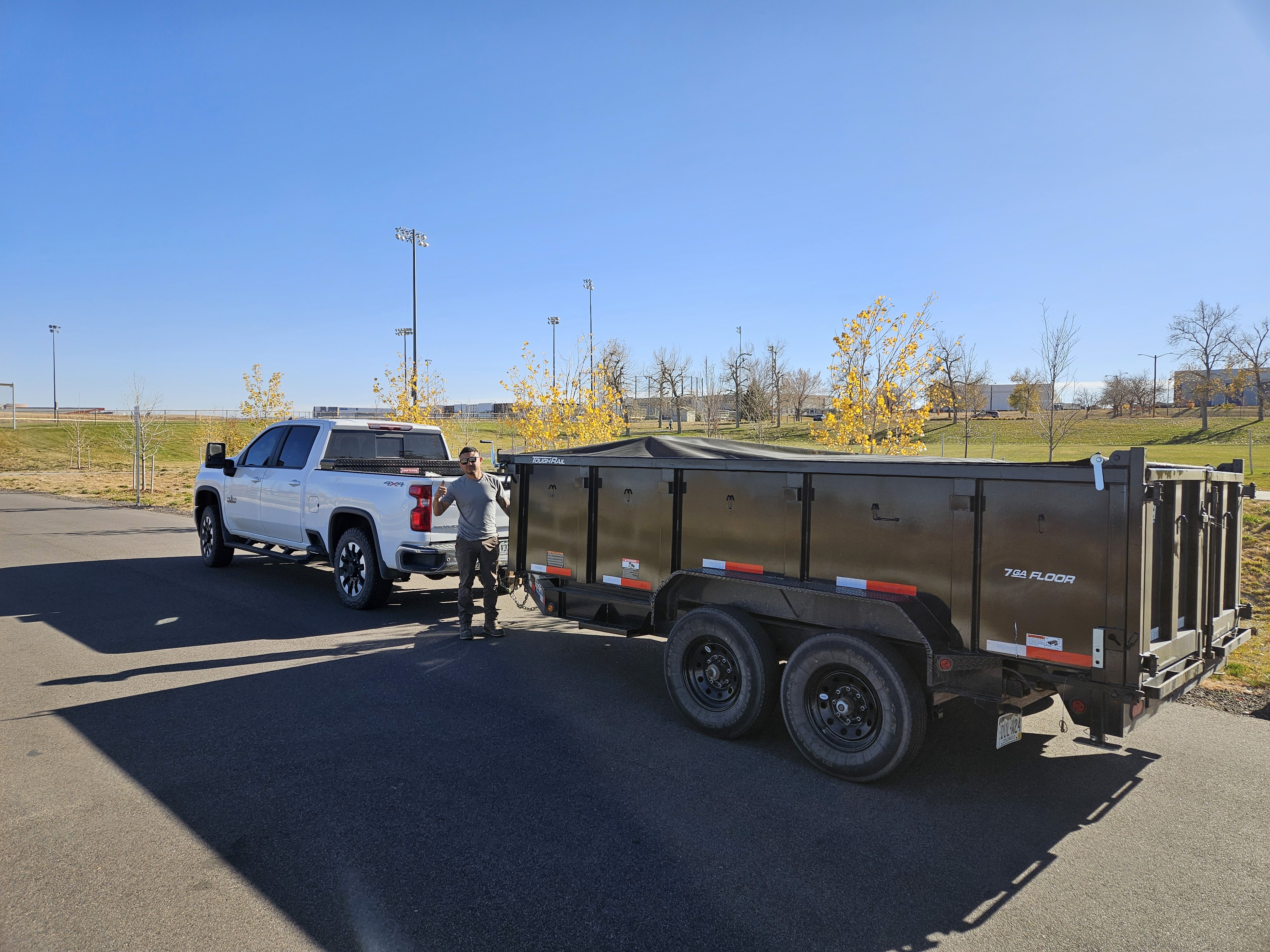 brown wooden house near bare trees during daytime