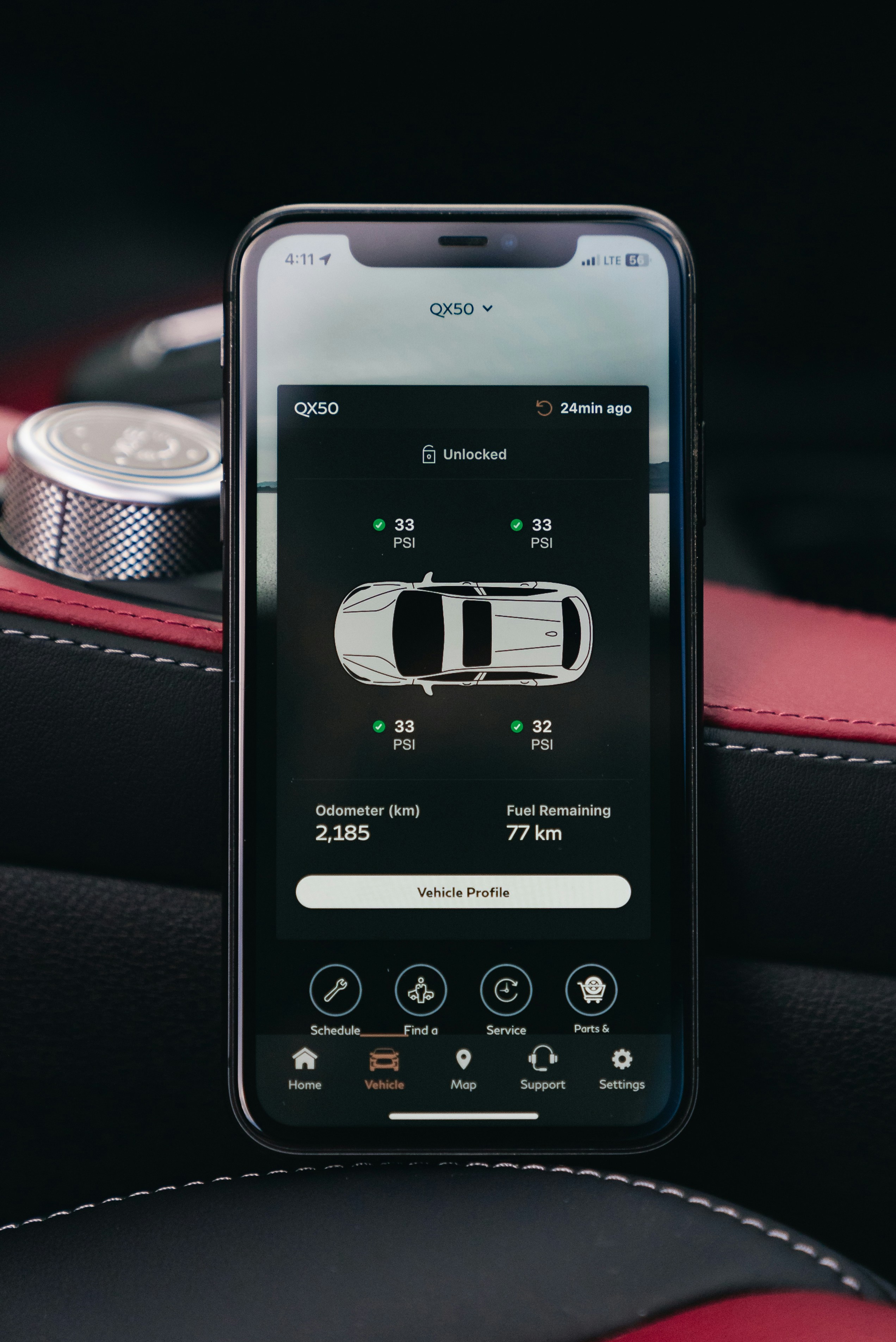 Smartphone displaying car tire pressure monitoring system