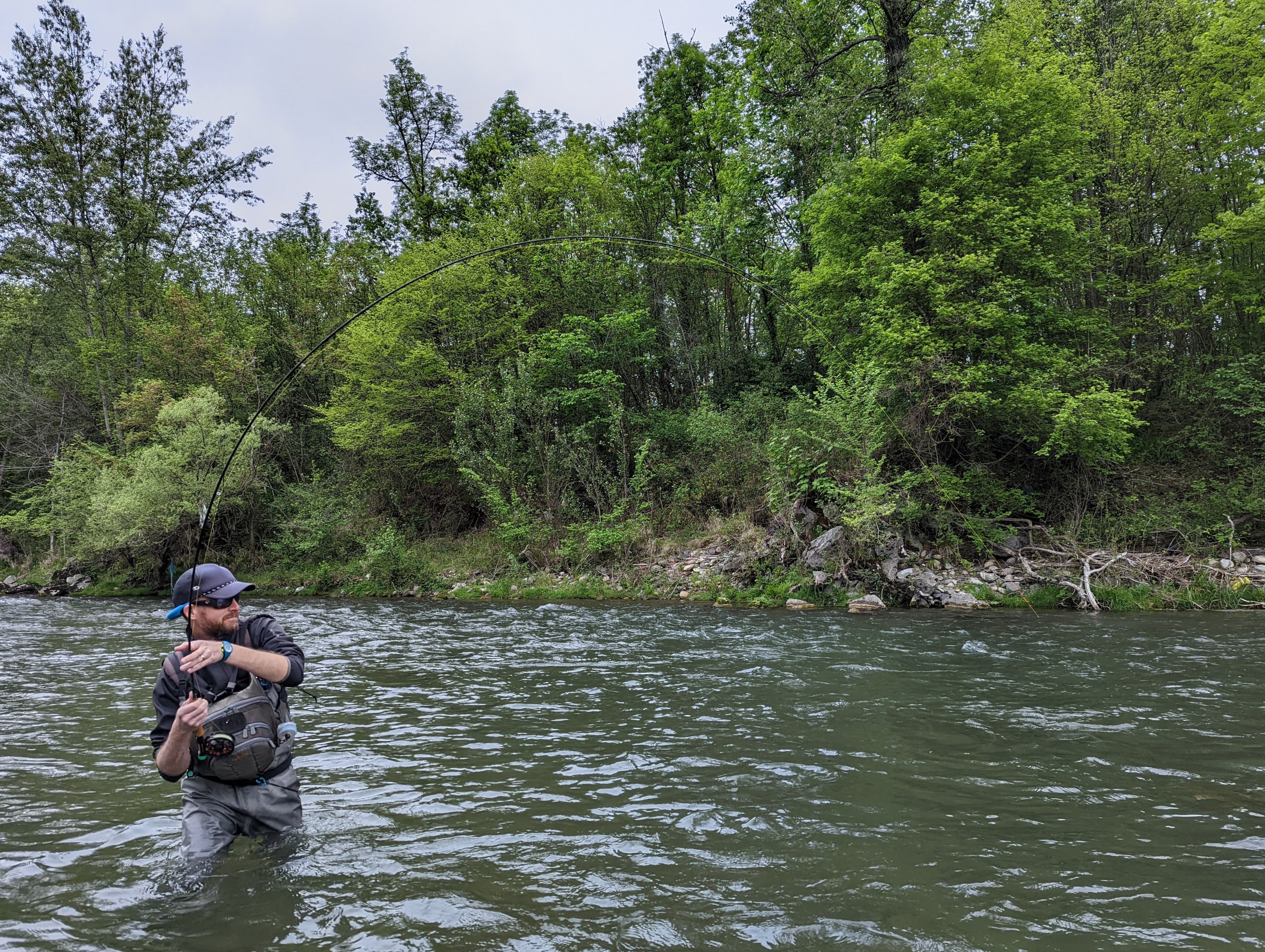 French nymph Pyrenees: an angler fishing in a rocky stream in Vicdessos.