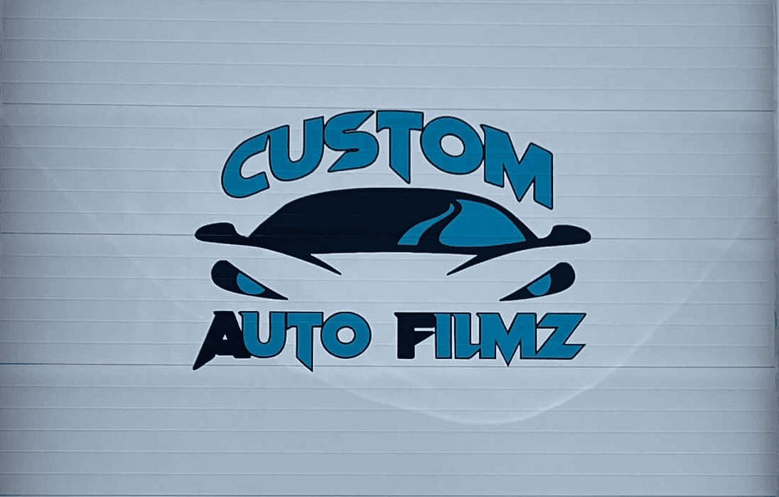 A garage door with custom vinyl business graphics.