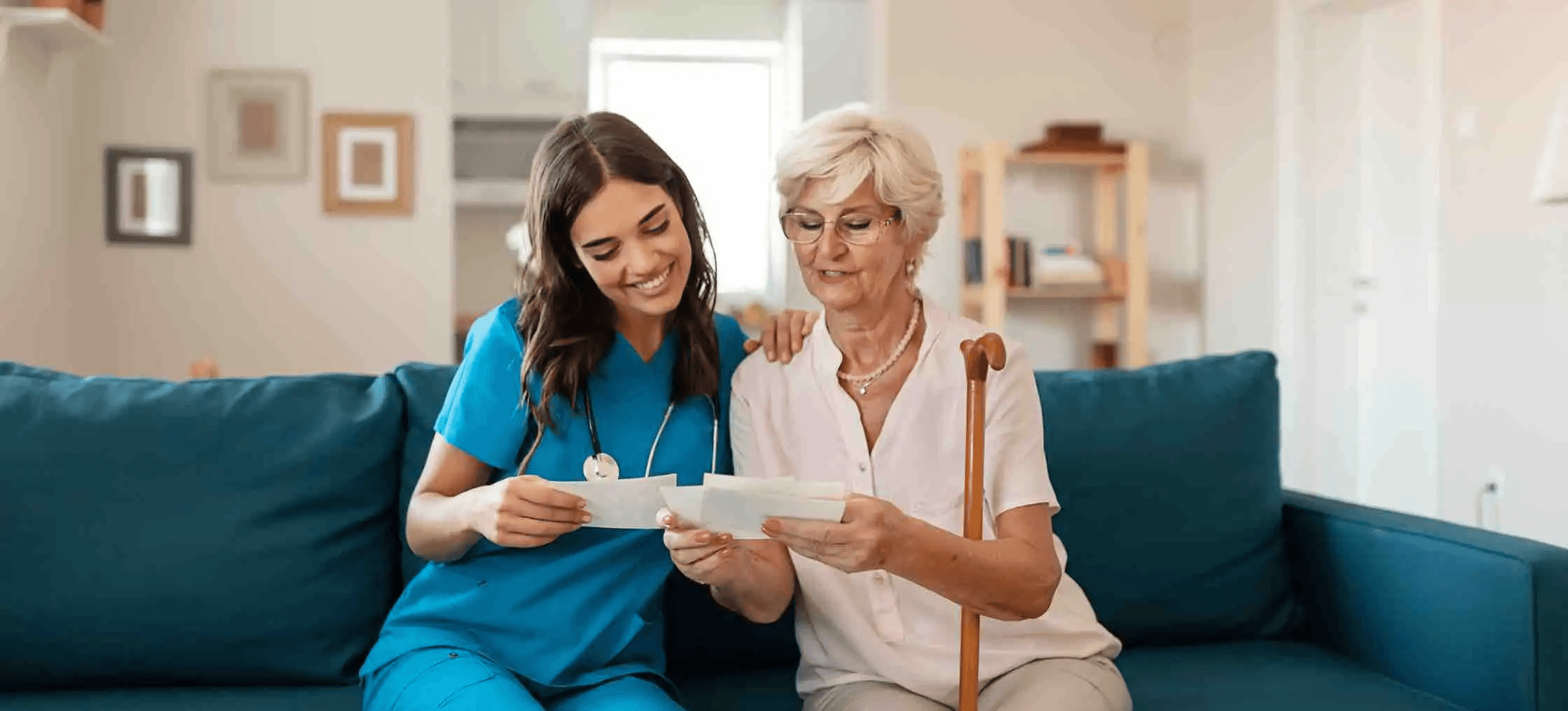 four boys laughing and sitting on grass during daytime