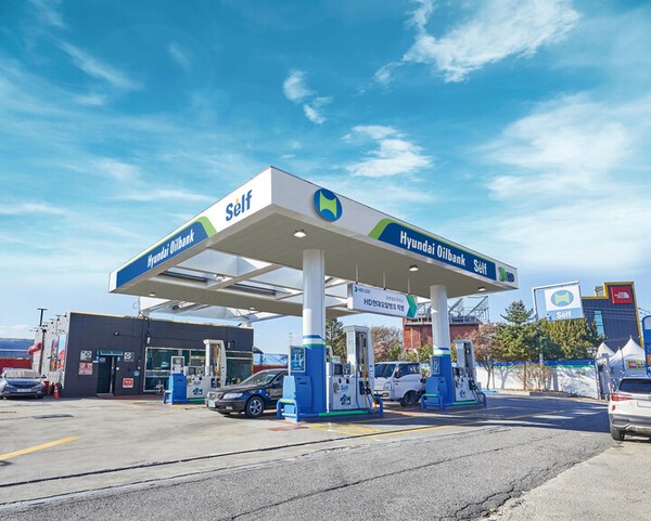 a man with a goatee smiles at the camera