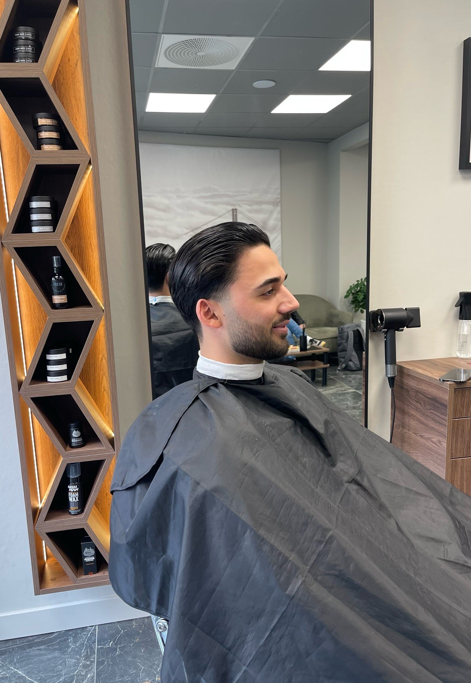 Salon styling station with gold-framed mirrors