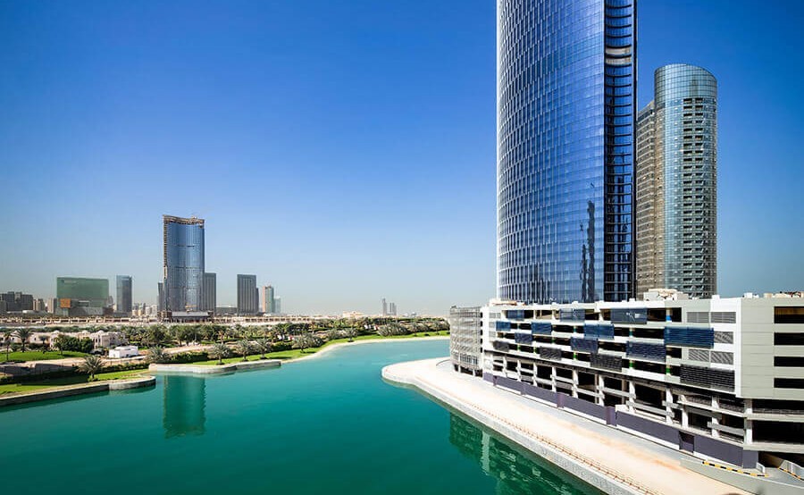 Exterior view of Addax Office Tower on the water, ideal for premium commercial investment.