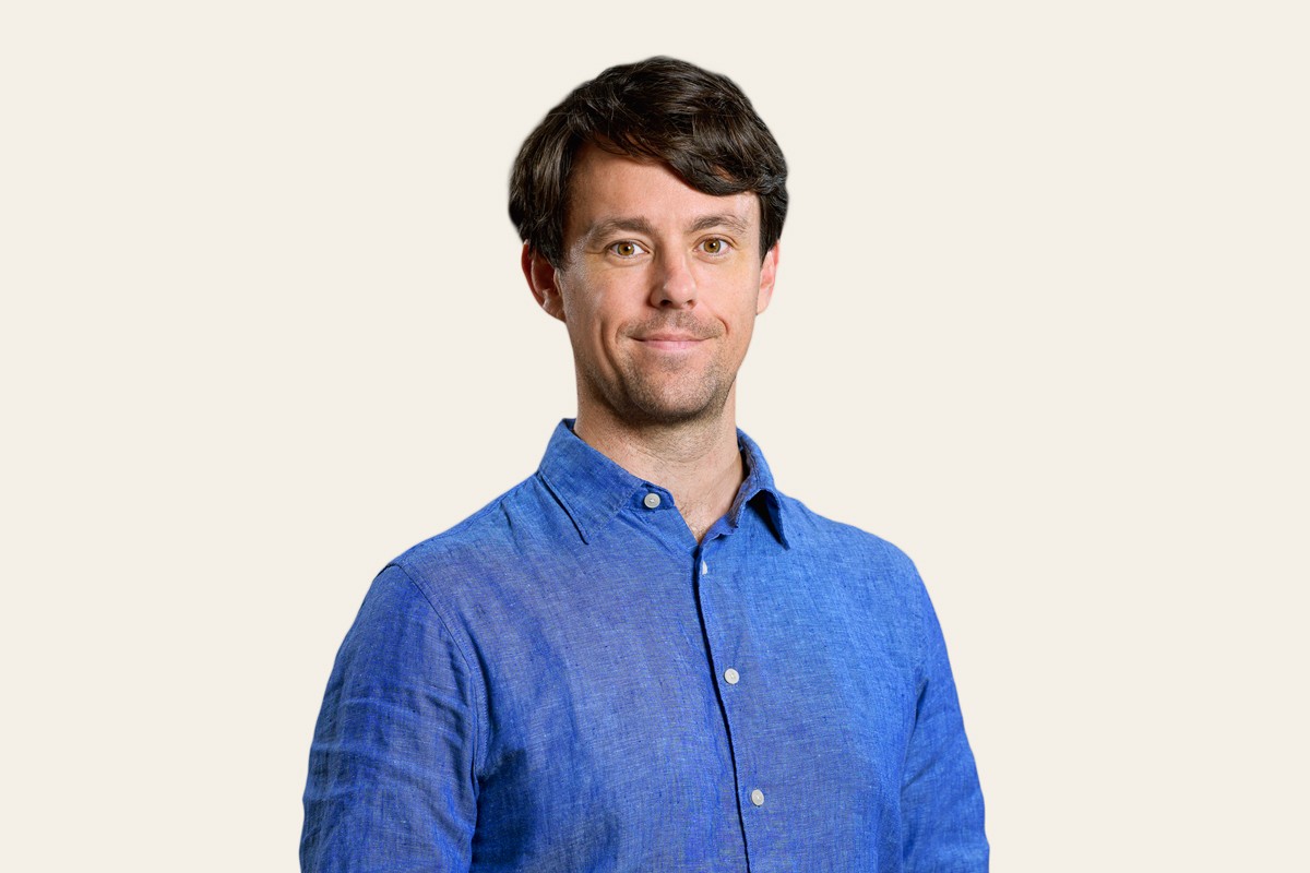 Diverse group of people in a modern office meeting.