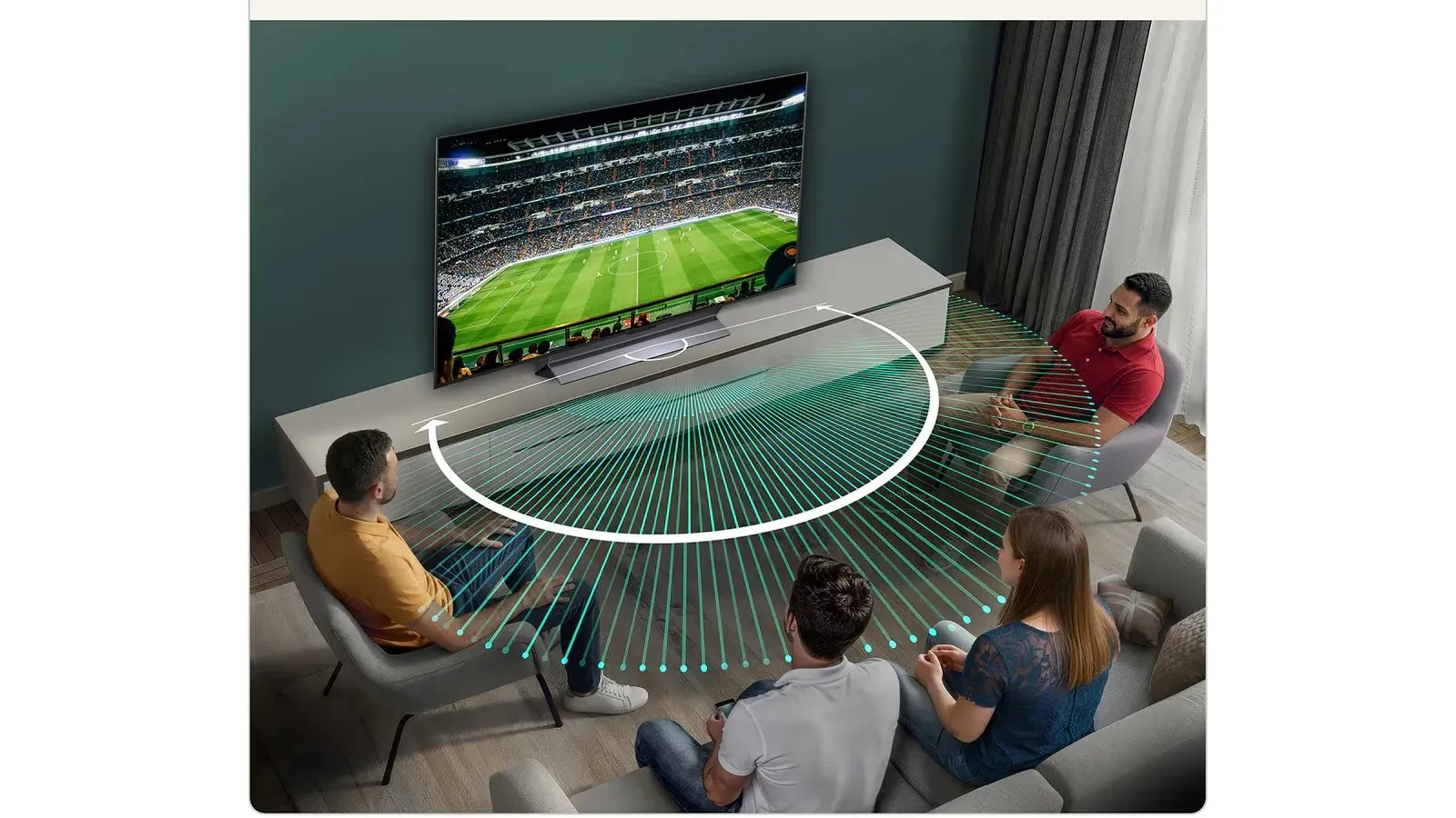 A group of four people are sitting in a modern living room watching a soccer match on a large flat-screen TV; the room features a sleek minimalist design with a white entertainment unit and a grey couch, highlighting a dynamic surround sound system visualized by green lines arching from a central soundbar.