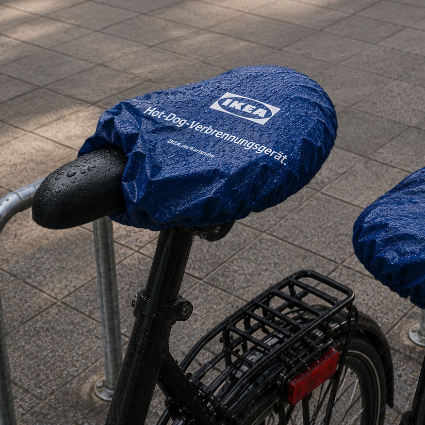 IKEA branded bicycle seat cover with humorous weather-related message installed in the city.
