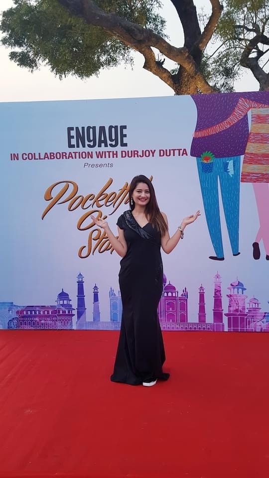 Almas Khan anchoring a corporate conference on stage