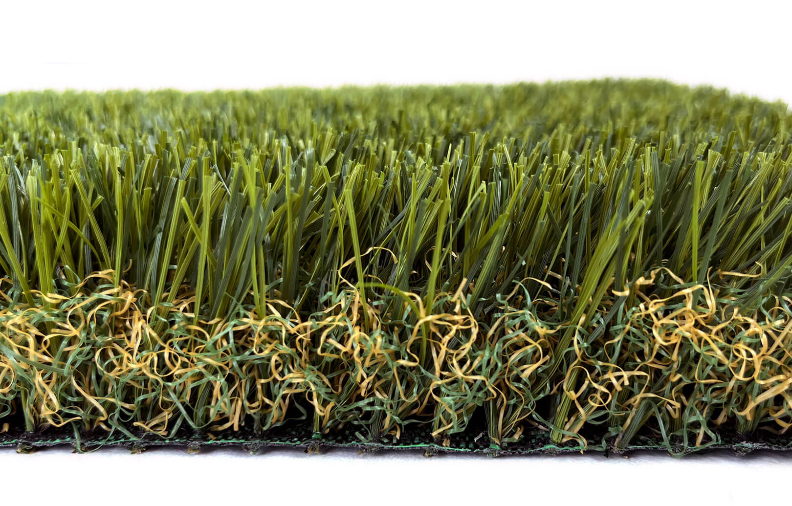 This is a close-up image of AGL Grass North's newest arrival, Royal 60, which boasts a micro-curled thatch of artificial grass in multiple shades of green.