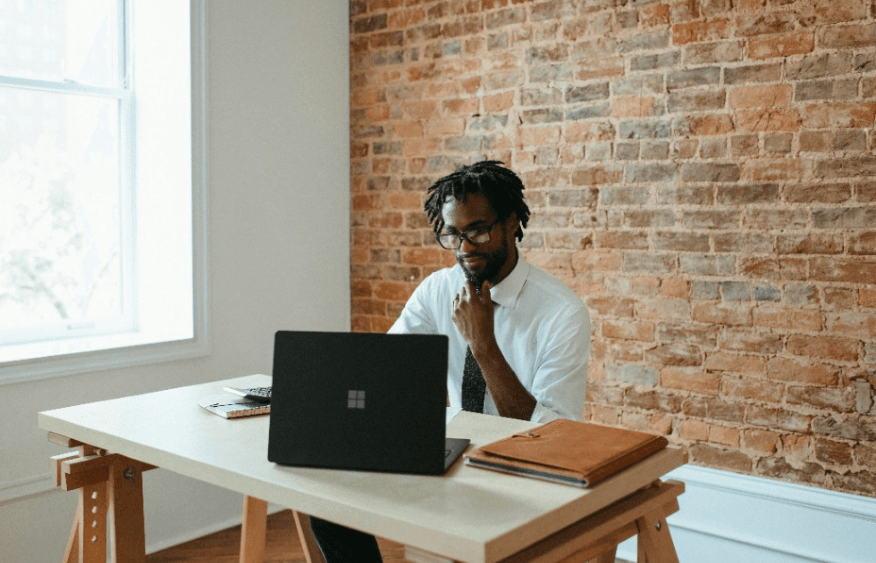 man concentrates while working at his laptop