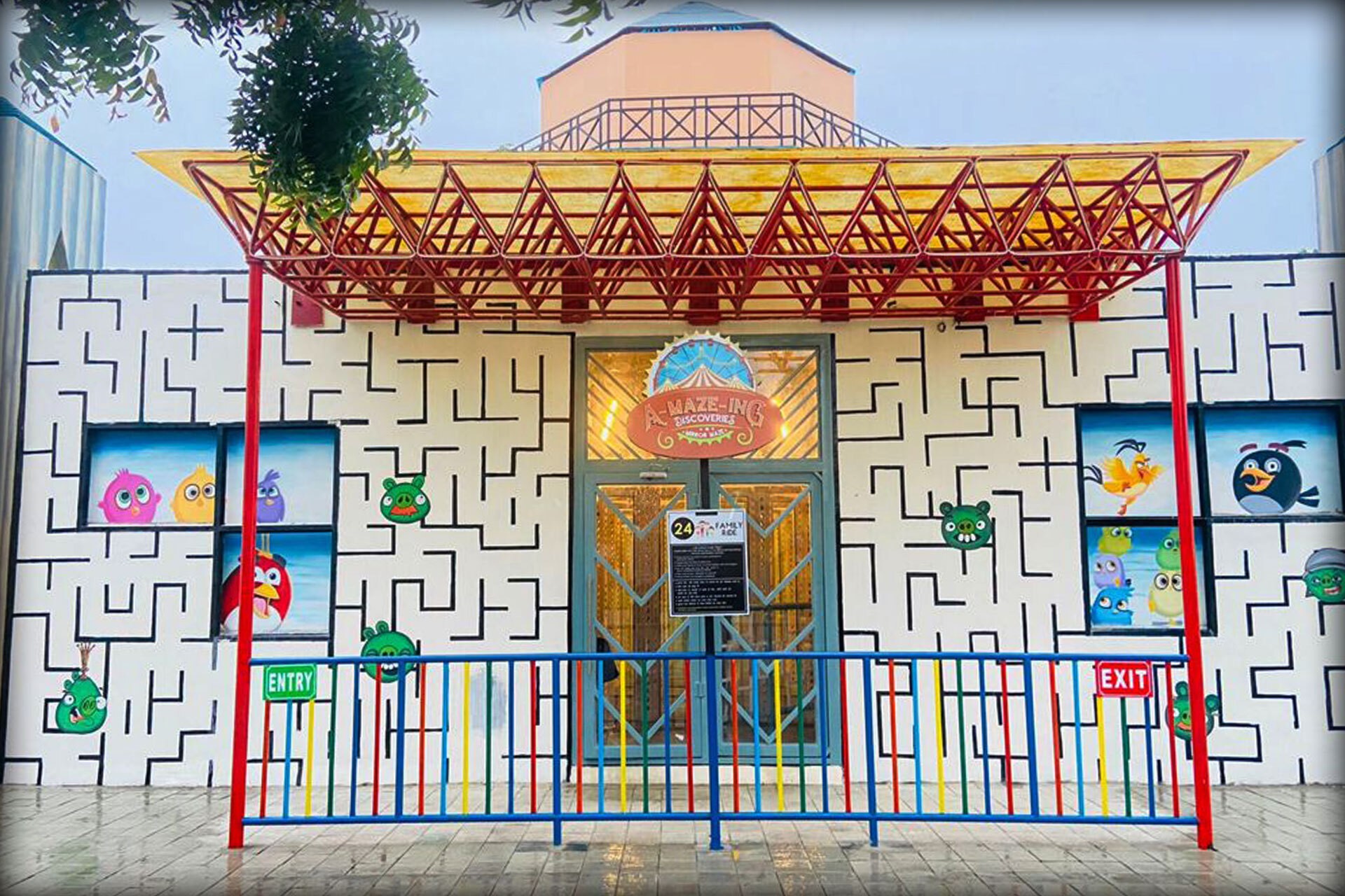 Sunlit modern living room with orange chair, plant.
