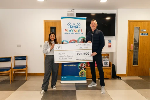 Playskill group photo with Graham and the cheque