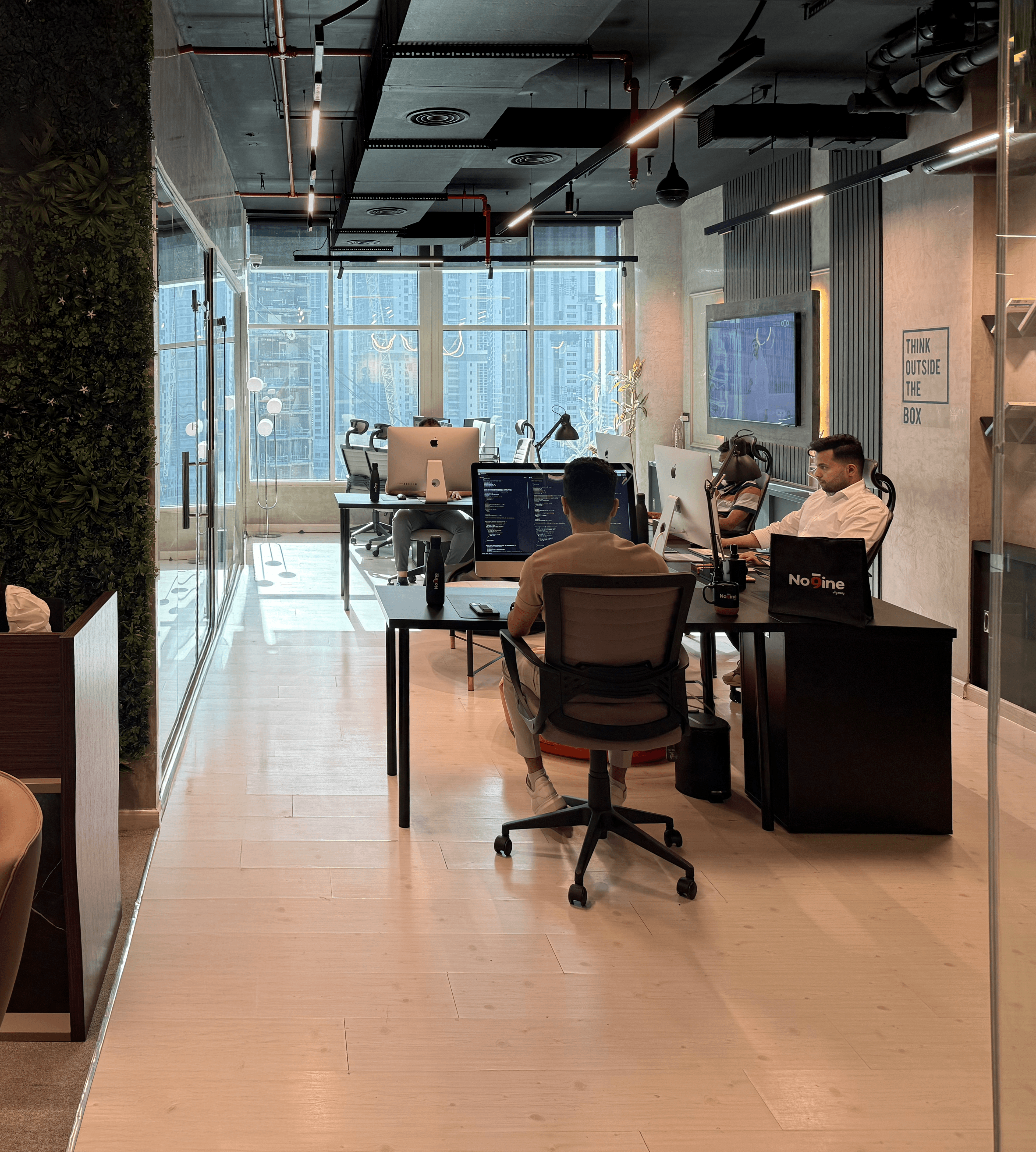 Team working in an office watching at a presentation