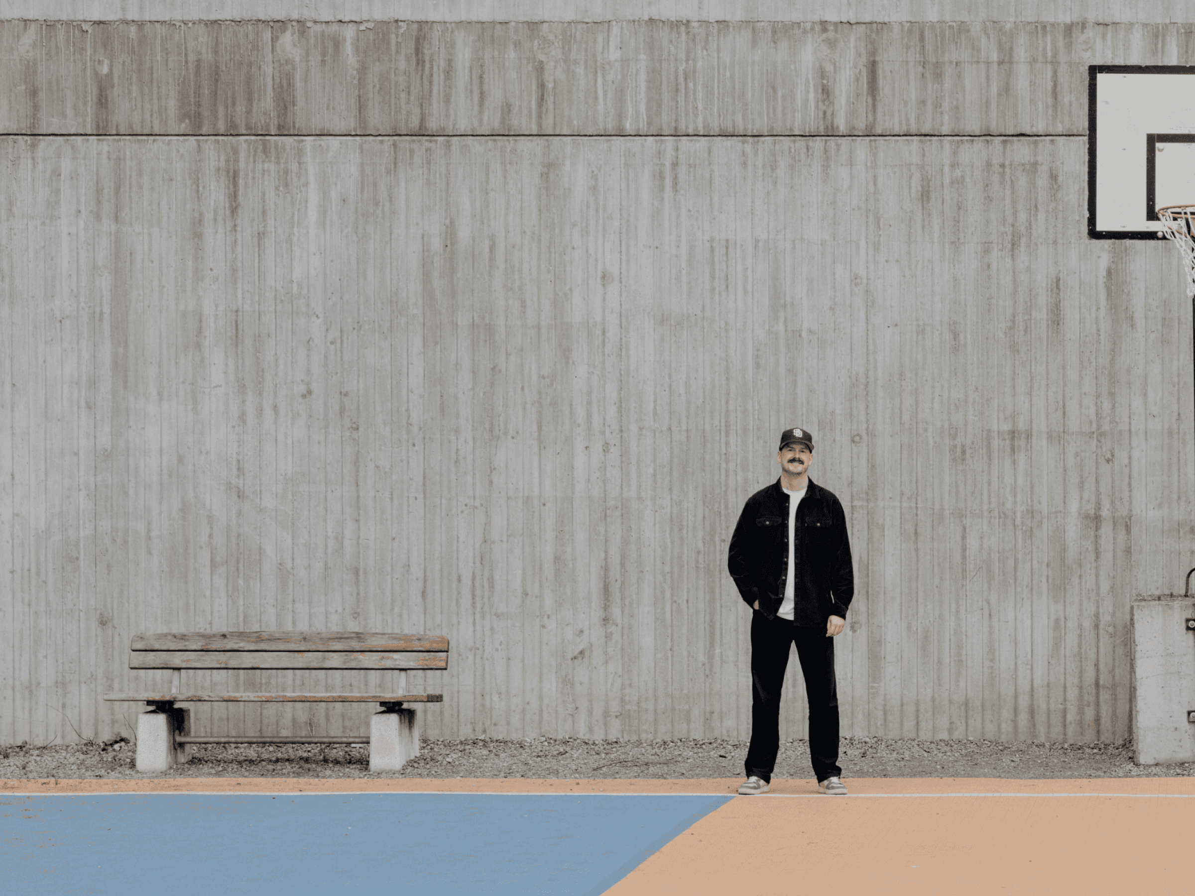 Image of Daniel standing on a basket court