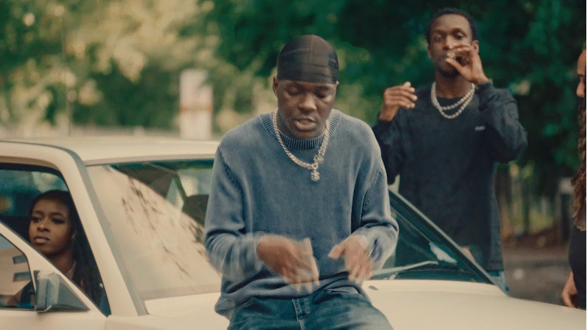 Two white houses nestled in a foggy, mountainous landscape.