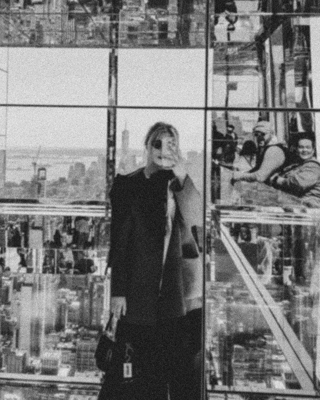 a blurry photo of a person standing in front of a wall
