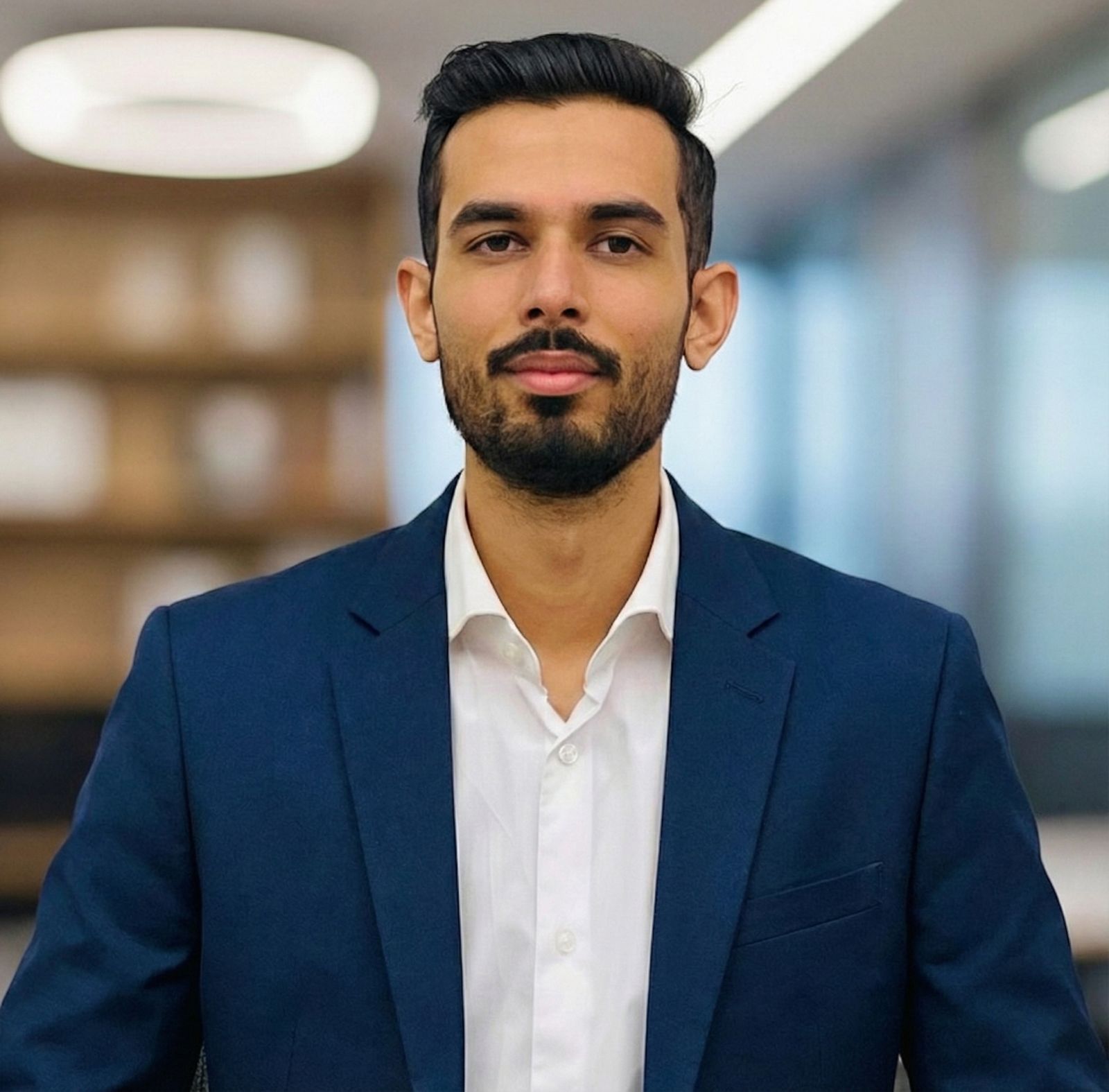 a man in a suit and tie posing for a picture