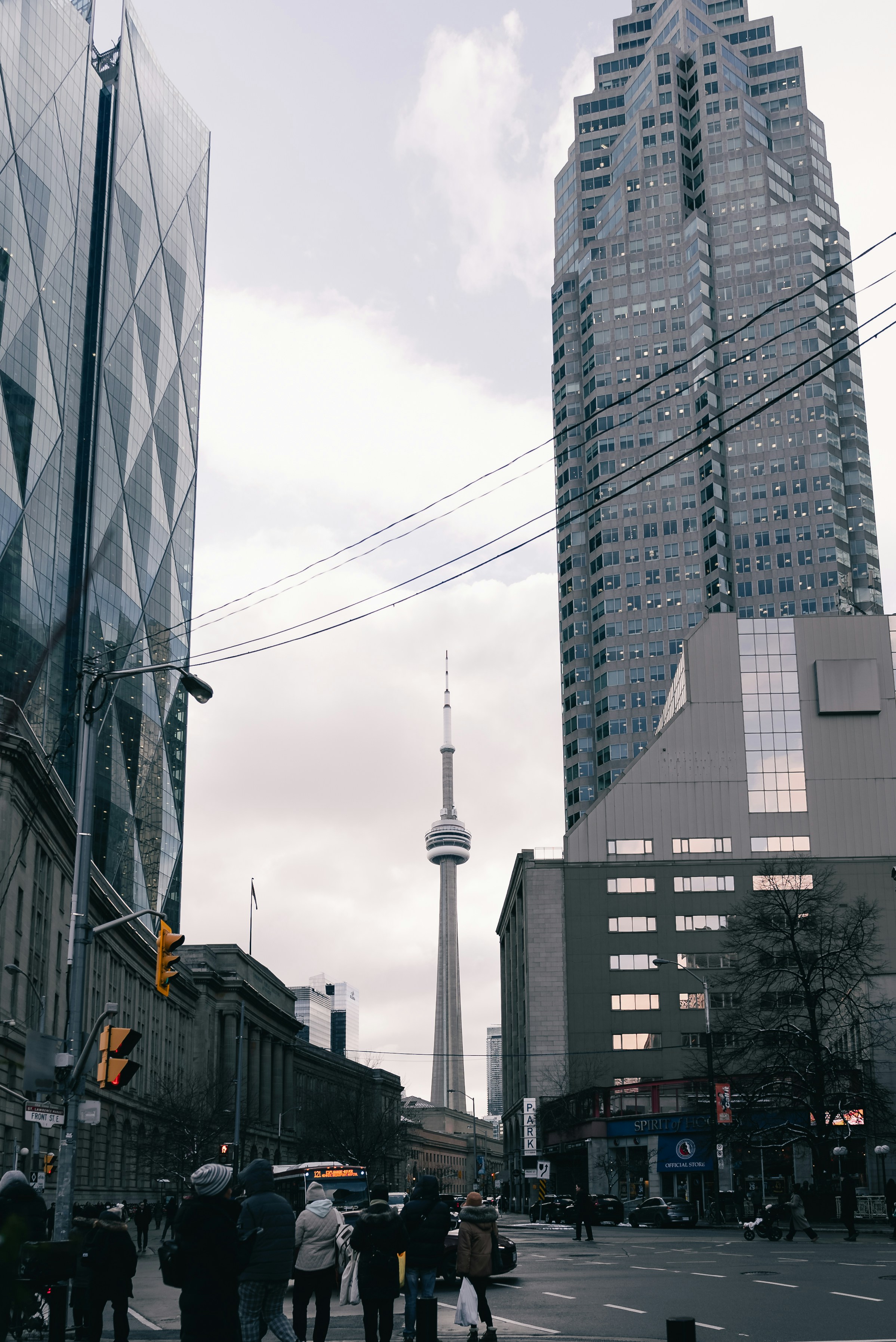 City street with tall buildings and cn tower.