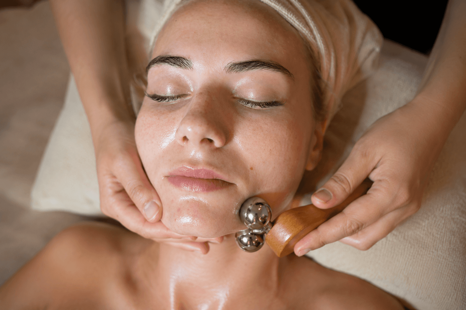 Man applying skincare product to his face