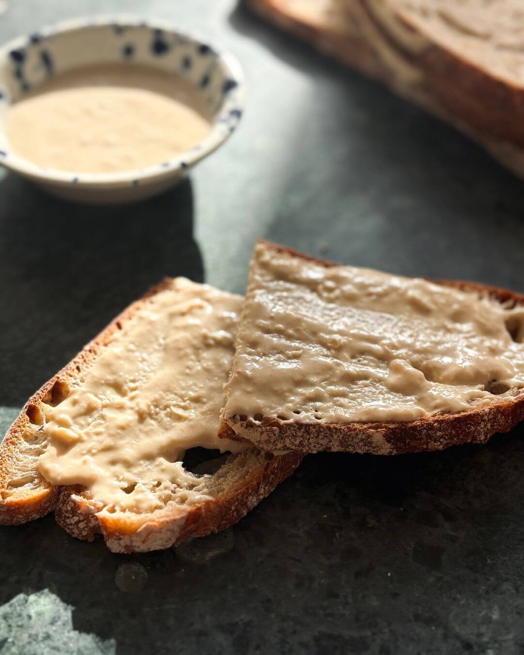 Creamy white bean spread served on sourdough toast, a smooth and savory white bean dip ideal for sandwiches, spreads, and healthy lunchboxes.