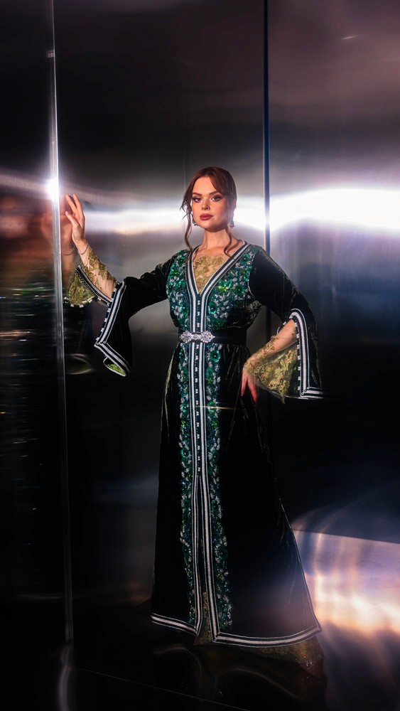 Deep Green Moroccan caftan with emerald embroidery, handcrafted luxury design combining Bahrain atelier and Moroccan craftsmanship
