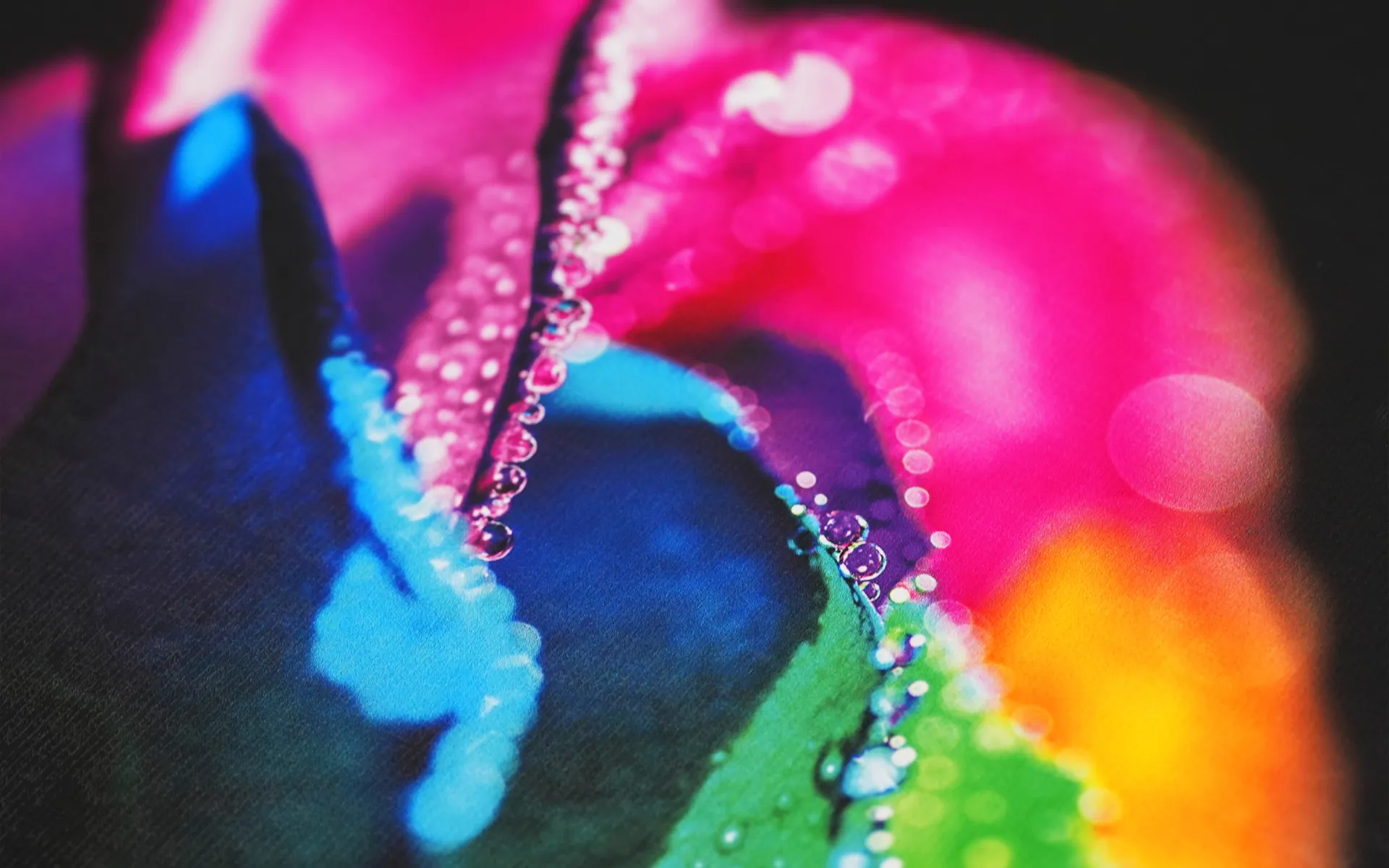 Close-up of vibrant neon colors and high-gloss textures printed on fabric using the Gravity Pro DTF printer, showcasing exceptional color reproduction for any design.
