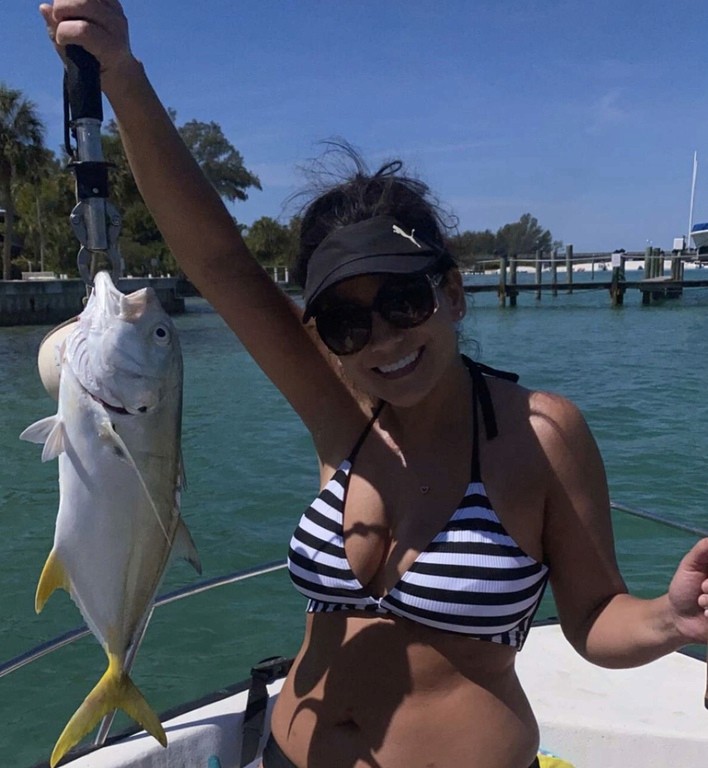 woman holding up a freshly caugh amberjack ann maria island, fl