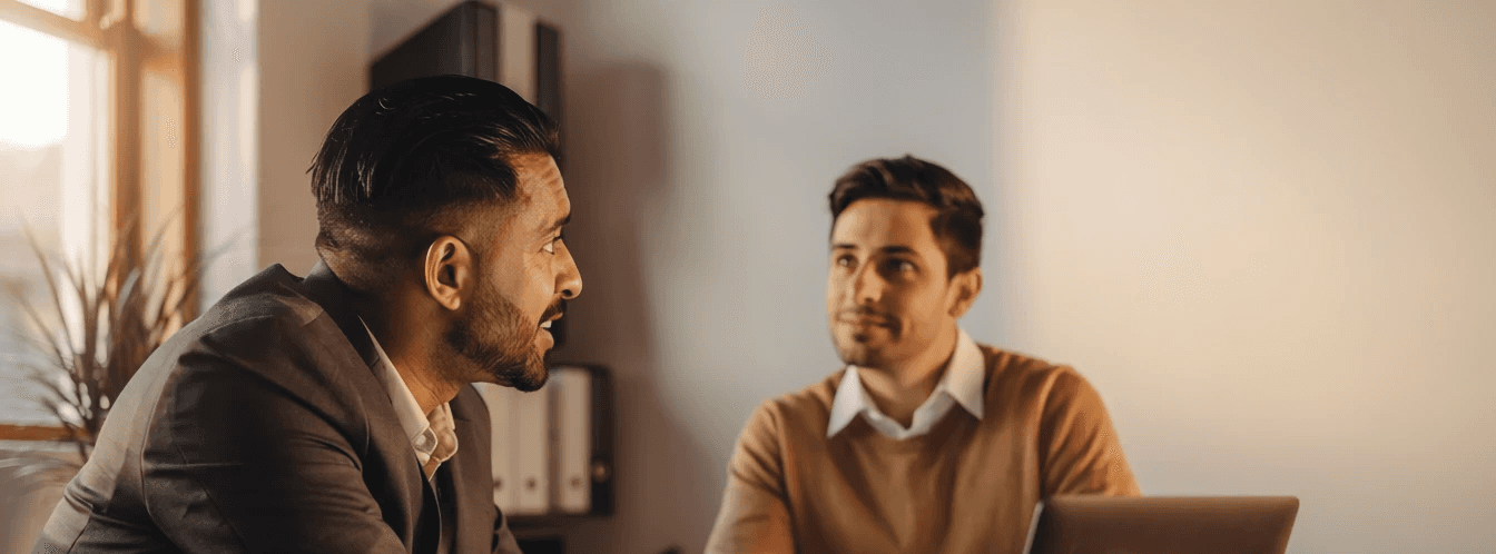 2 men talking