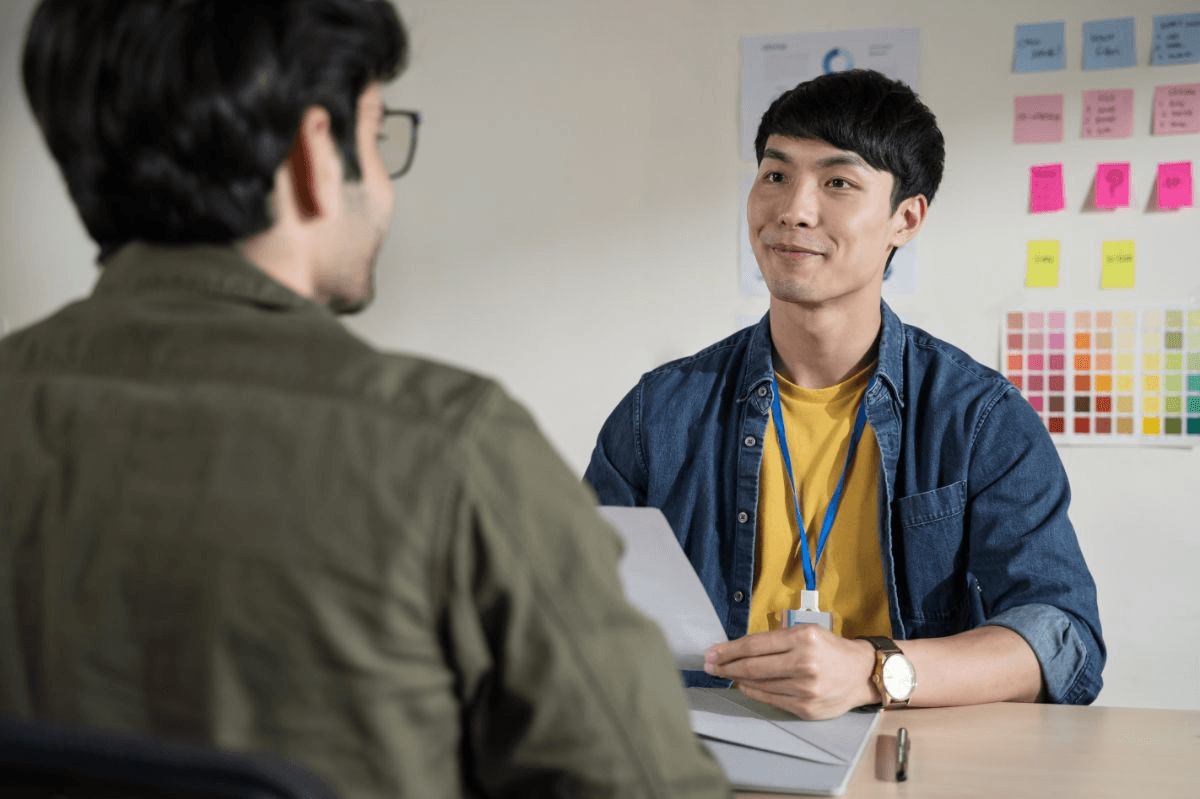 High school student confidently presenting research findings during a college admissions interview